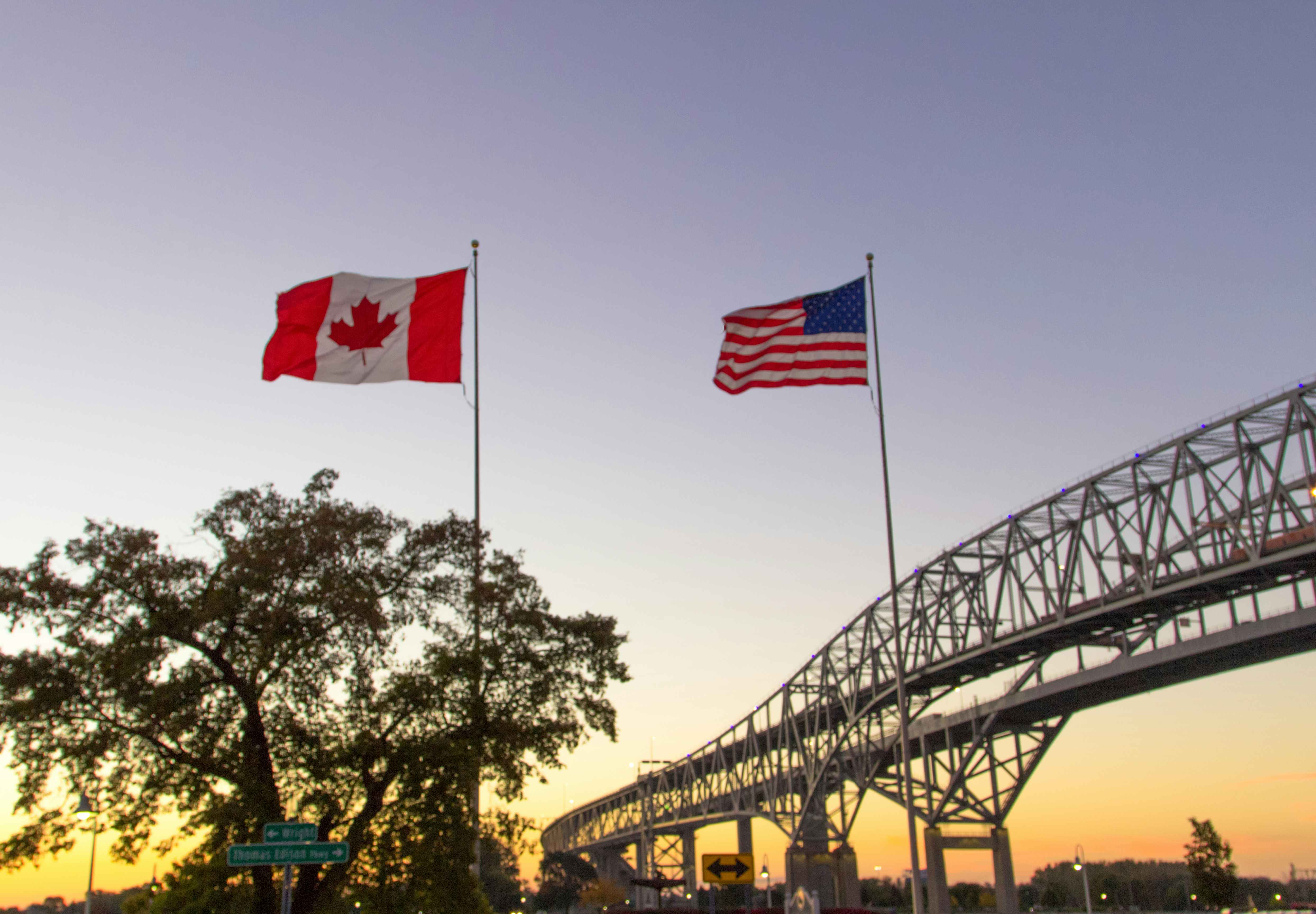 American and Canadian flags by the International Blue Water Bridge Crossing between Port Huron, Michigan, and Sarnia, Ontario 