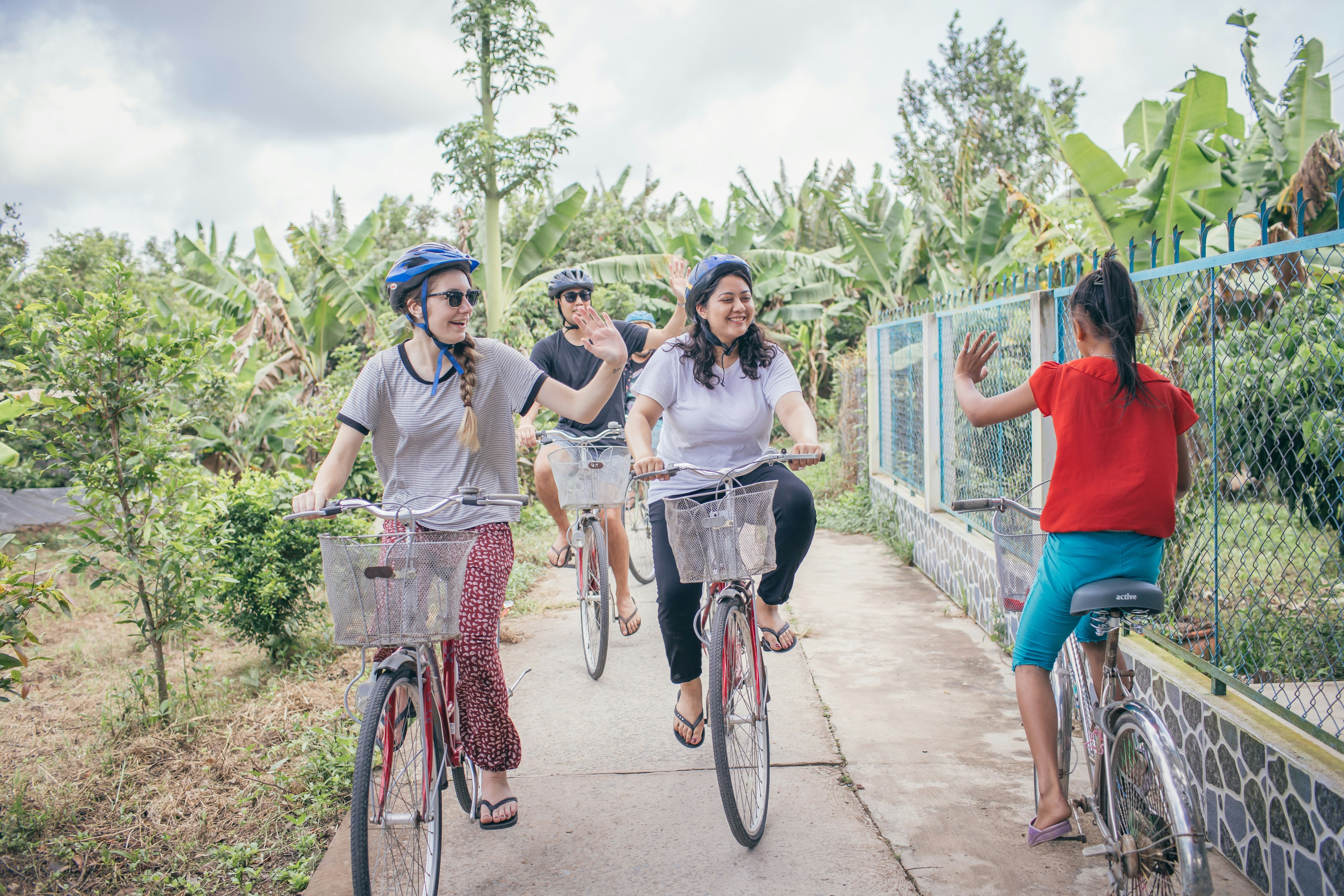 Group of teenagers cycling in Mekong Delta.jpg