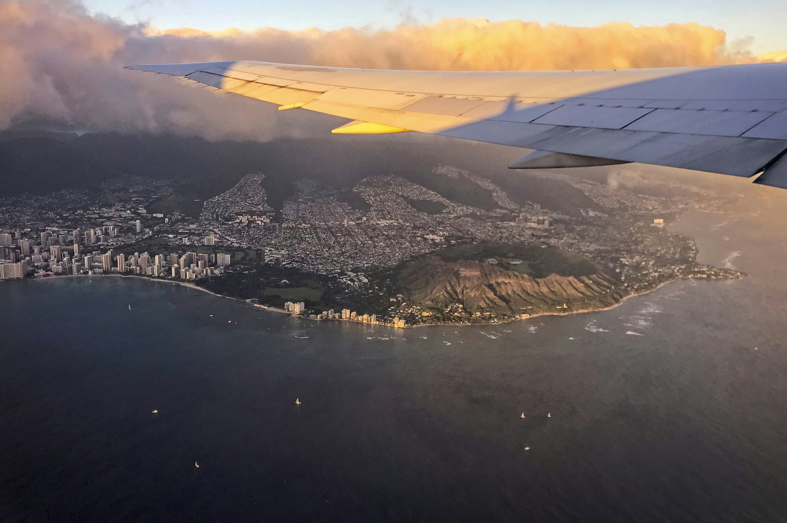View of Diamond Head crater located on Oahu, Hawaii from airplane after takeoff
