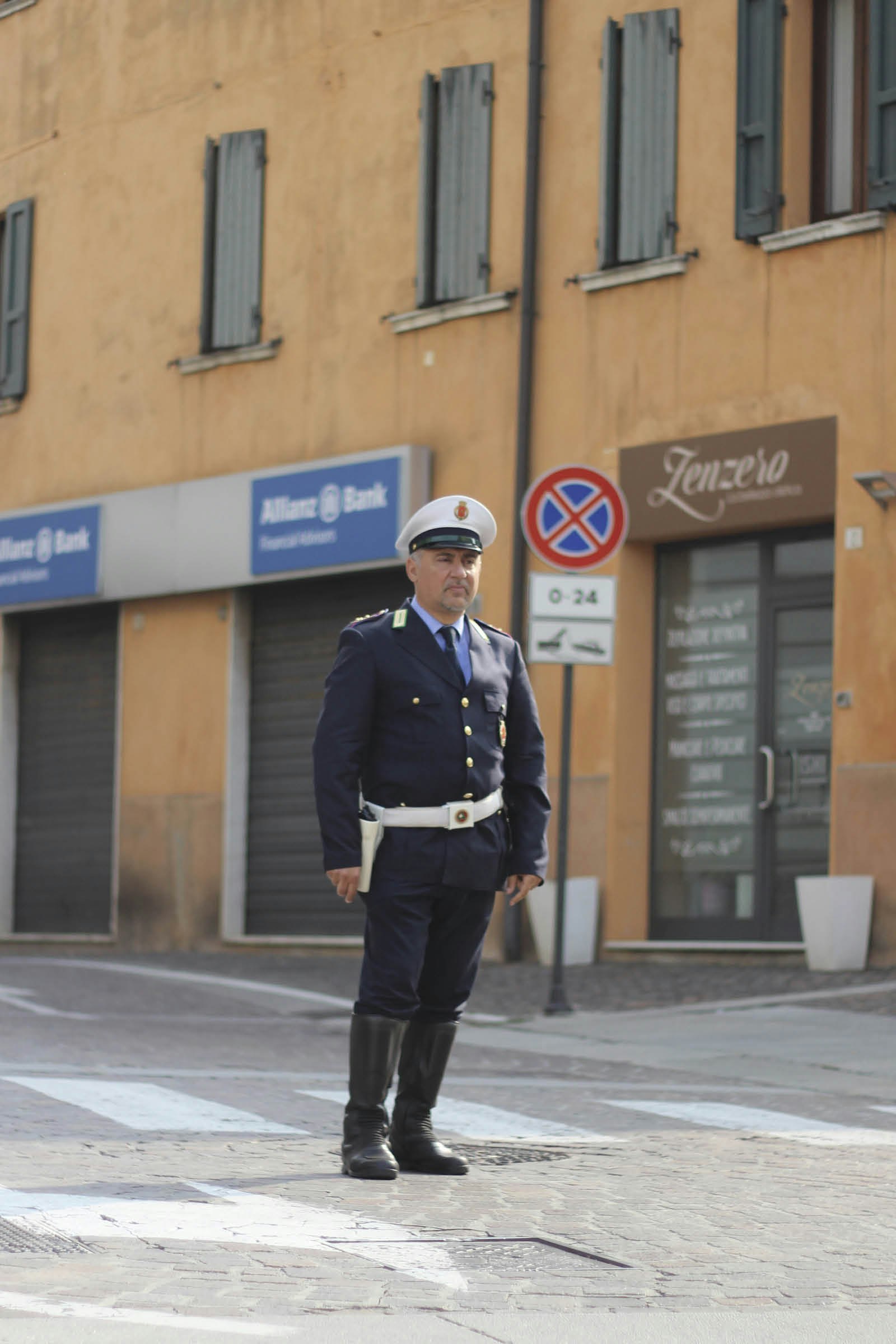 A white-capped policeman controls the traffic in Montichiari