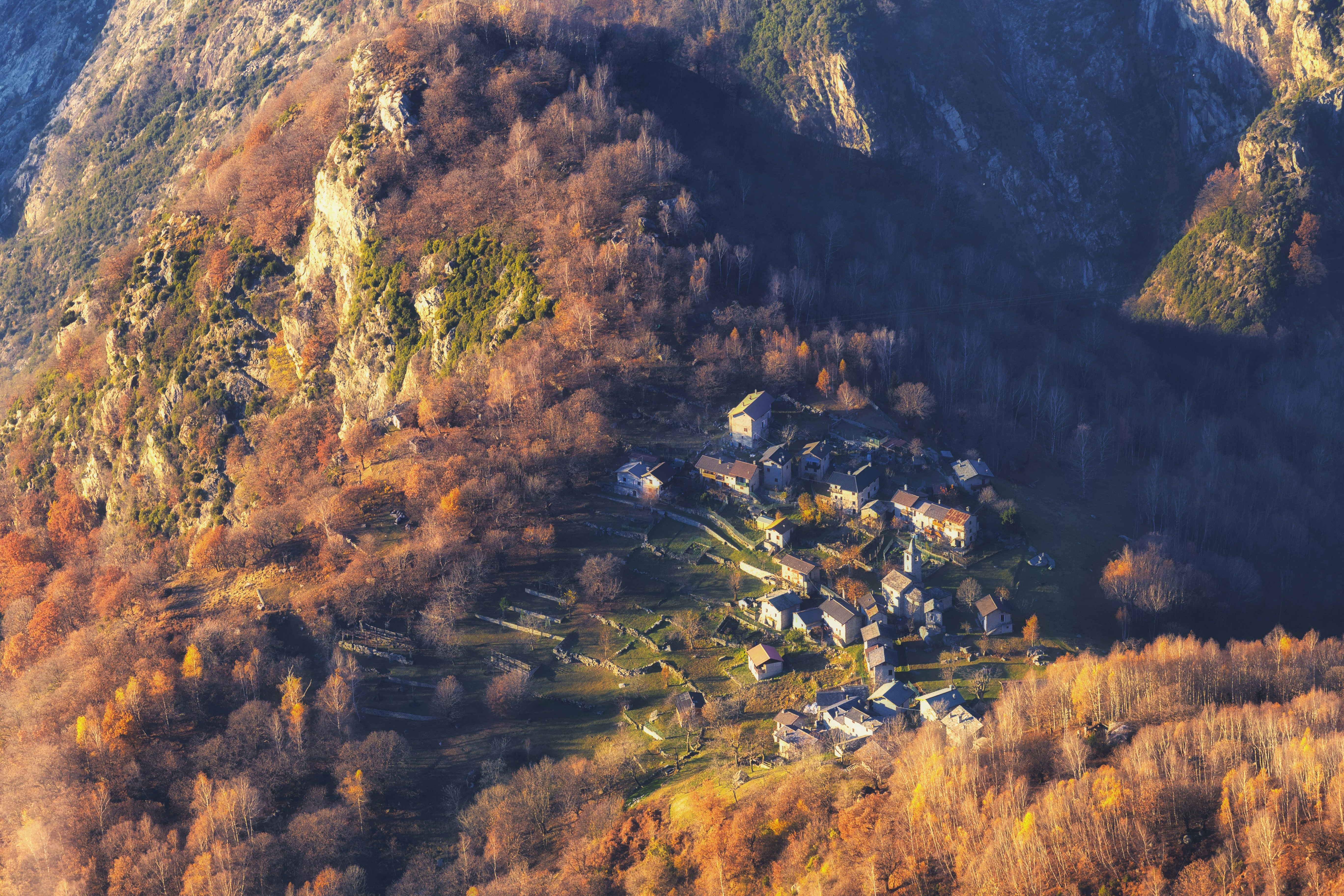 The mountain village of San Giorgio in northern Italy is seen from above as it is awash in fall colors
