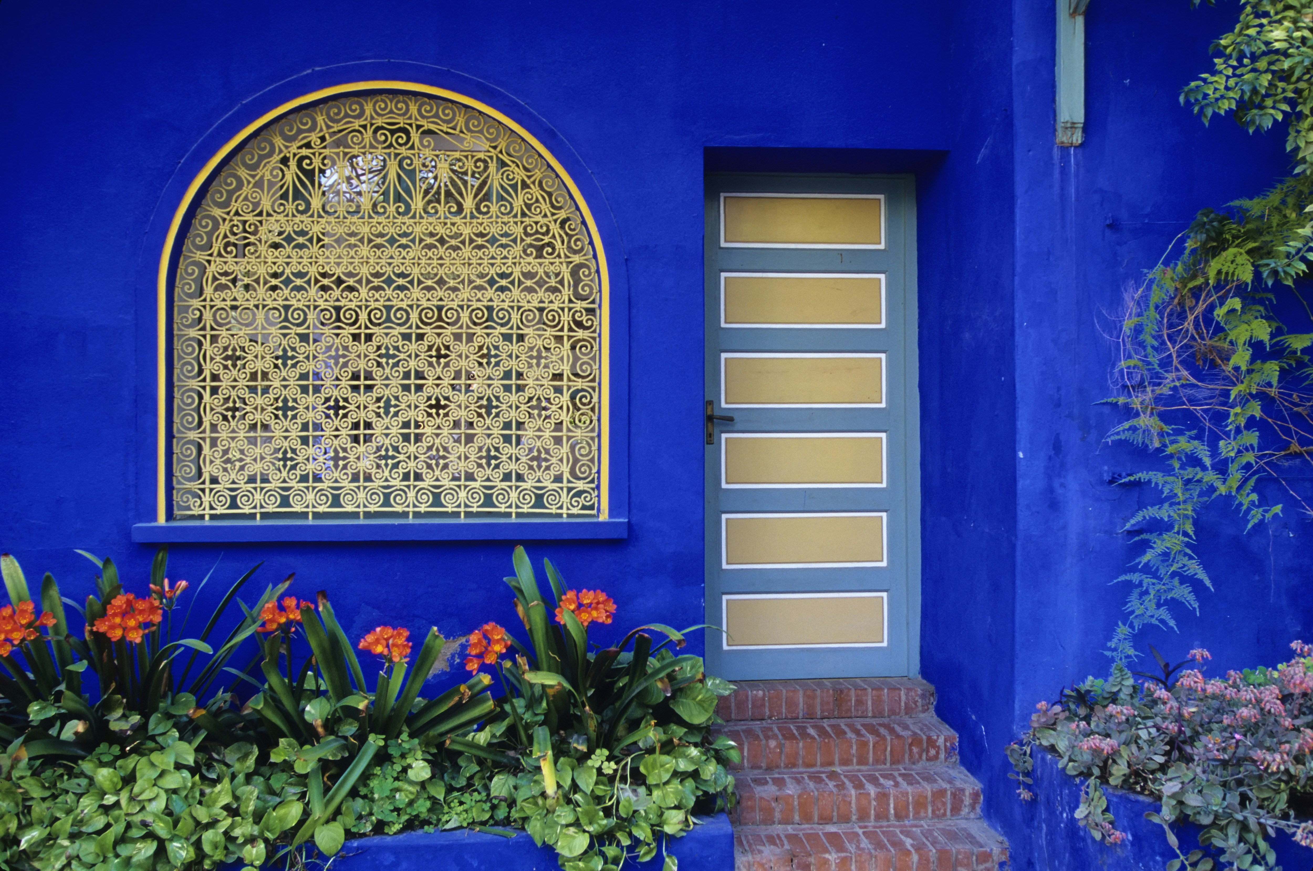 Blue and yellow exterior of a building in Jardin Majorelle, Marrakesh