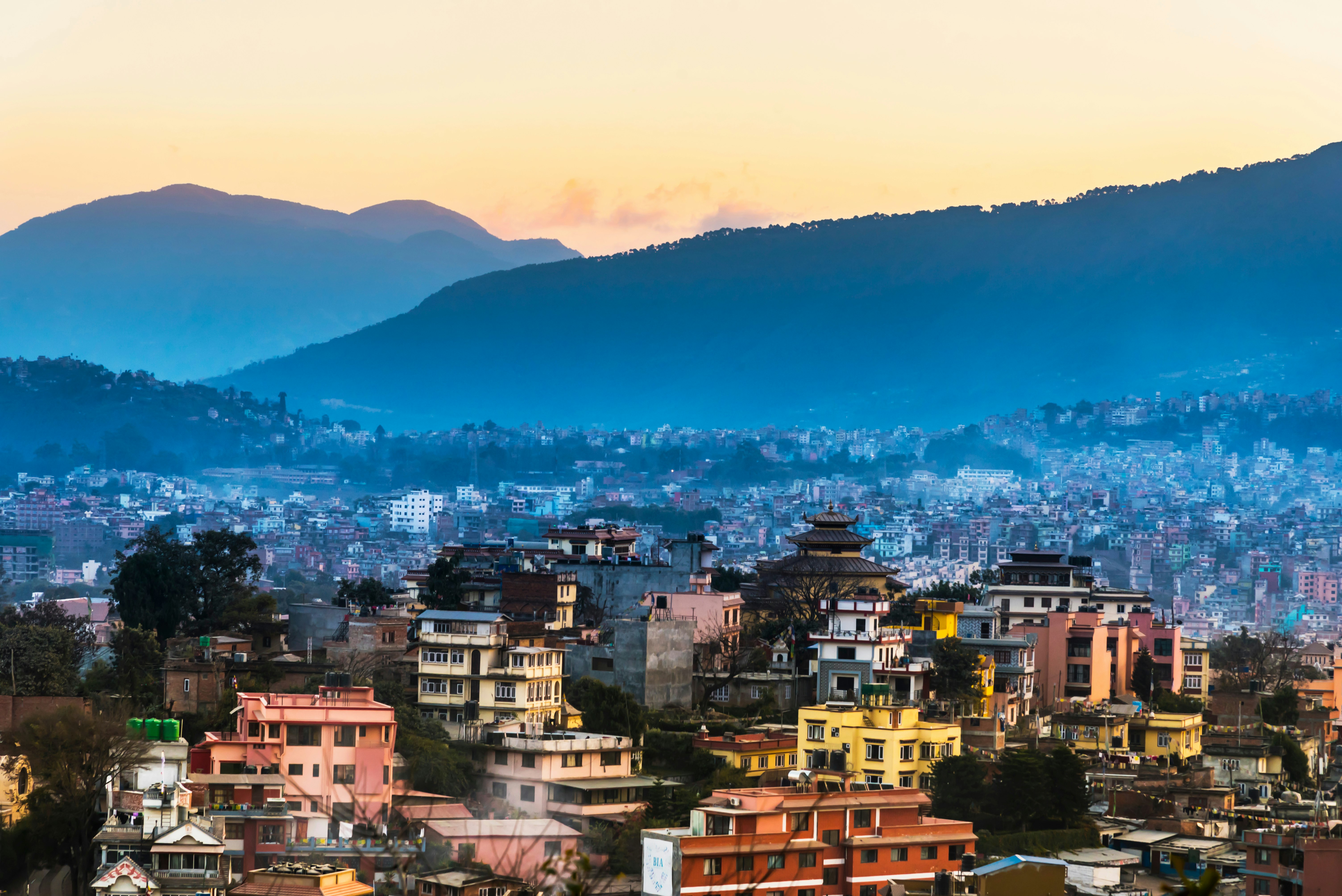 The Kathmandu city skyline. The Himalyan mountains are visible in the background