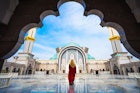 A woman enters the Federal Territory Mosque in Kuala Lumpur