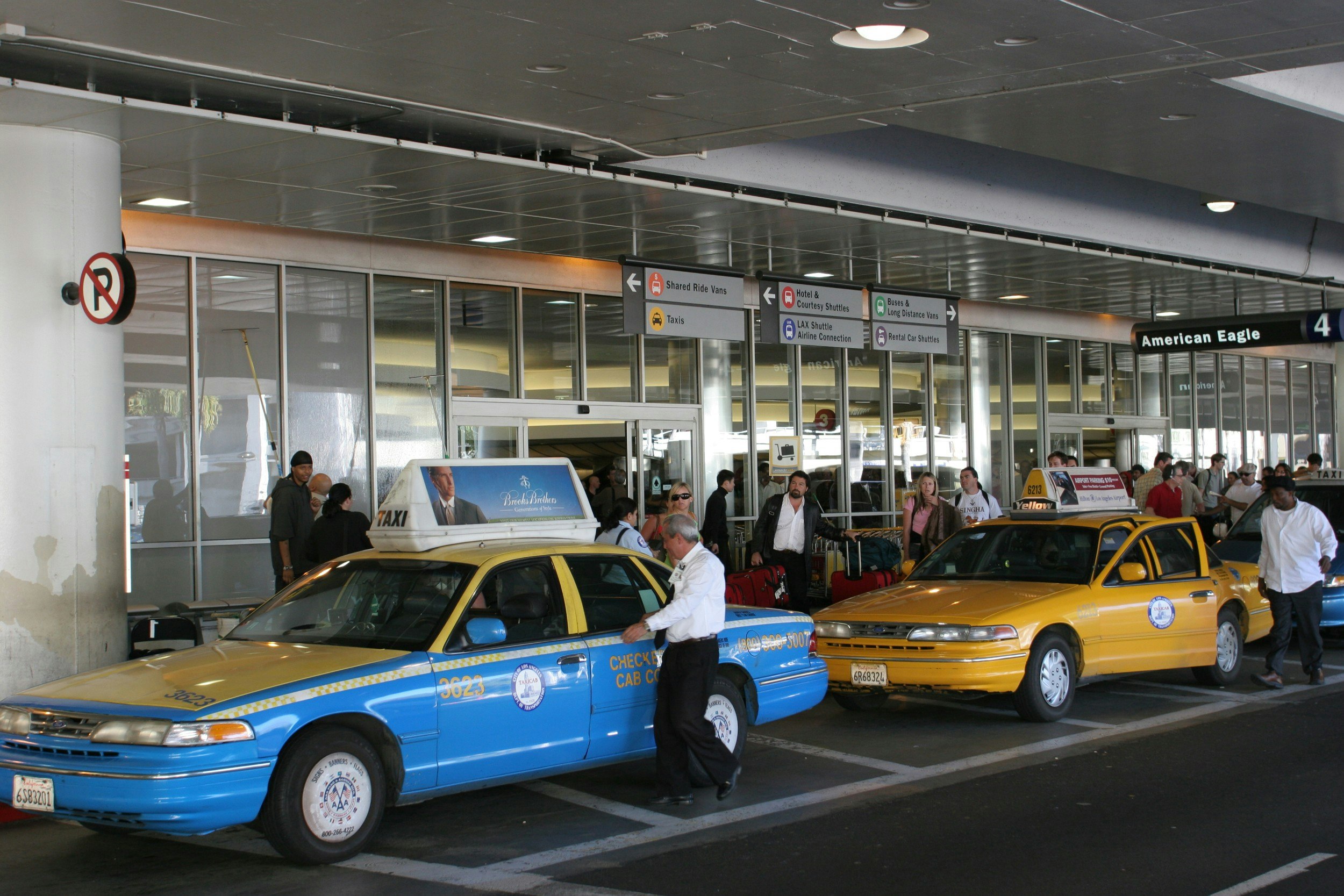 Two taxis  wairing for passengers outside LAX airport 