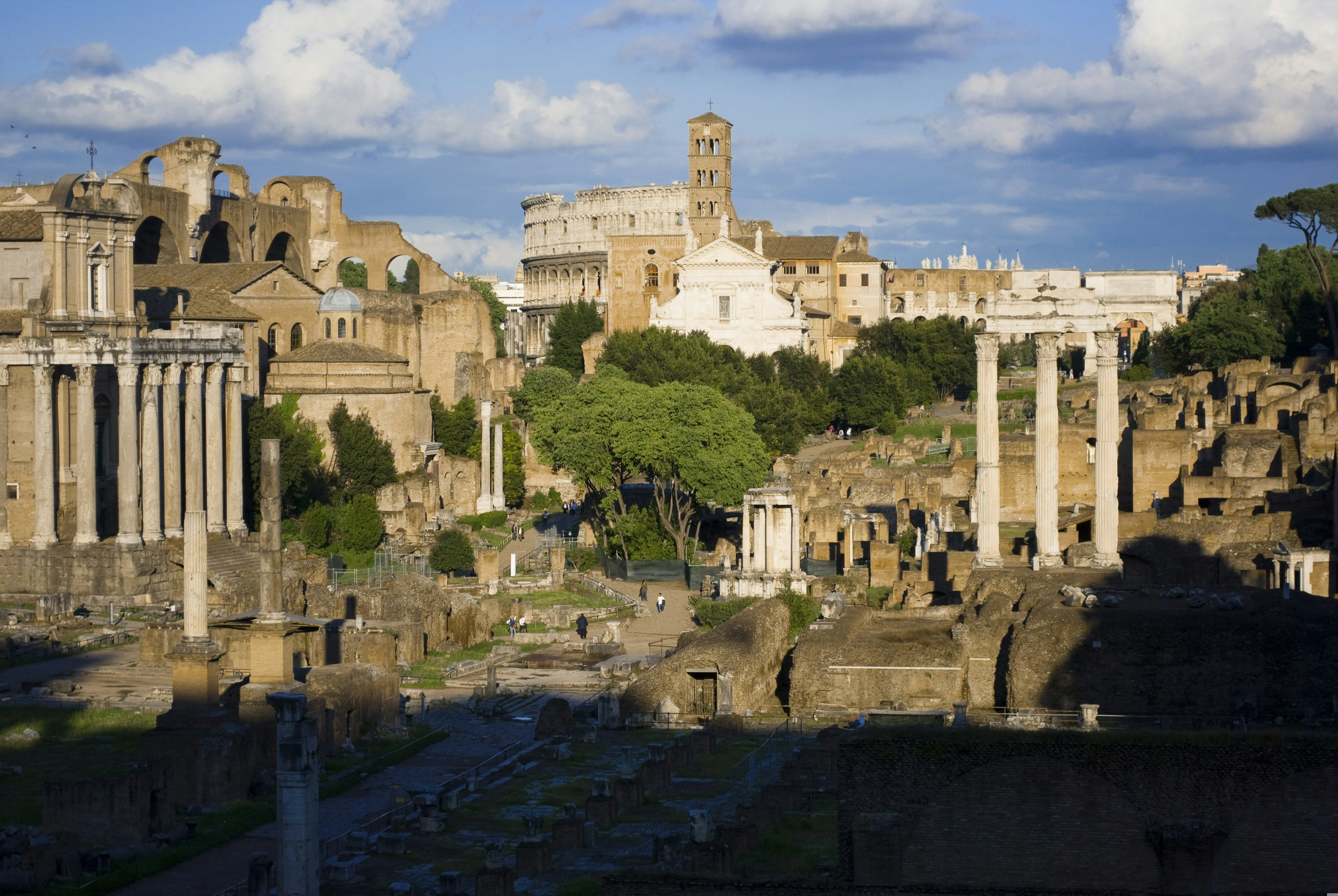 Views of the Roman Forum and Colosseum in sunlight, from the base of the Campidoglio