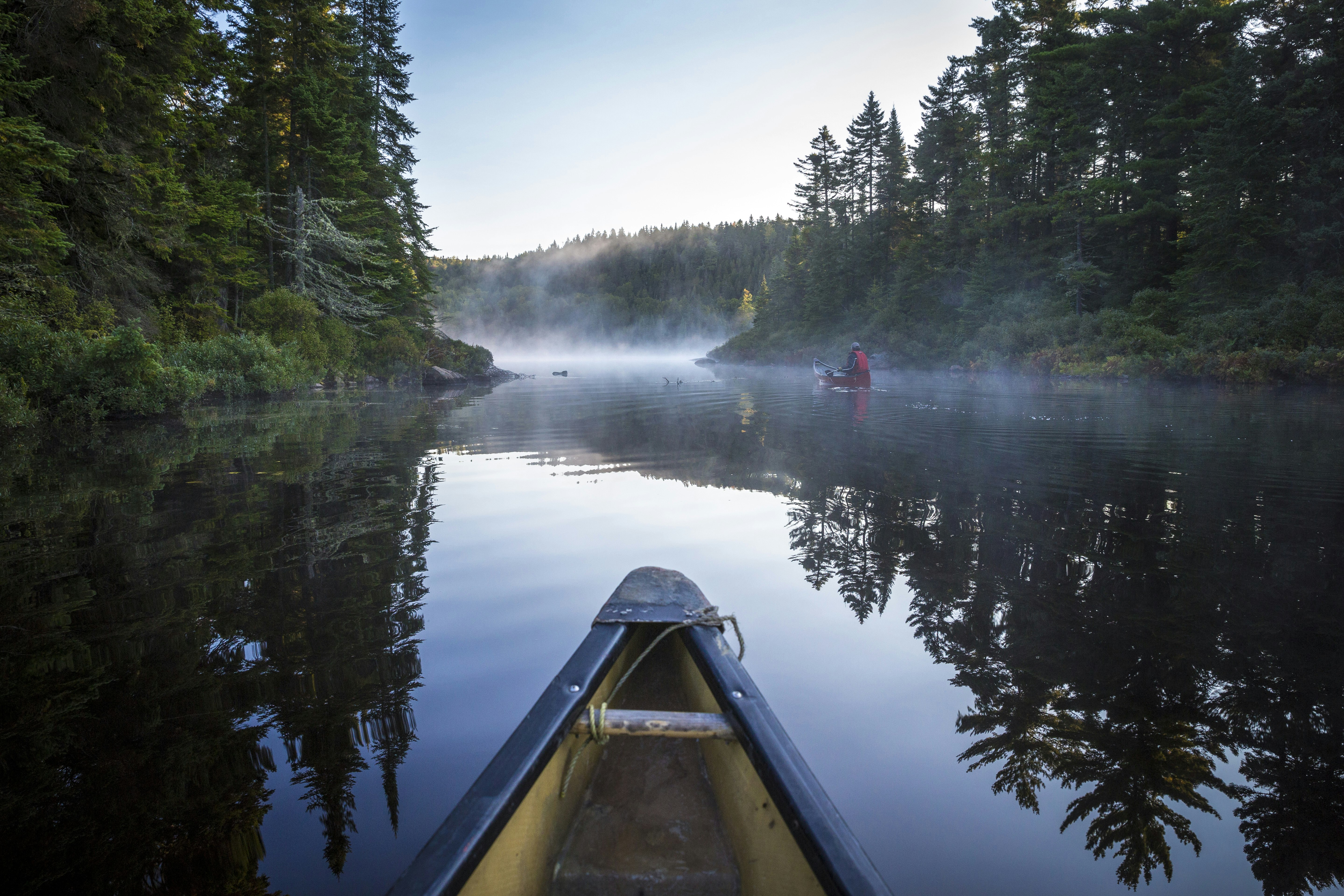 A canoe on the calm waters of Lac-du-Fou in Mauricie National Park, Quebec