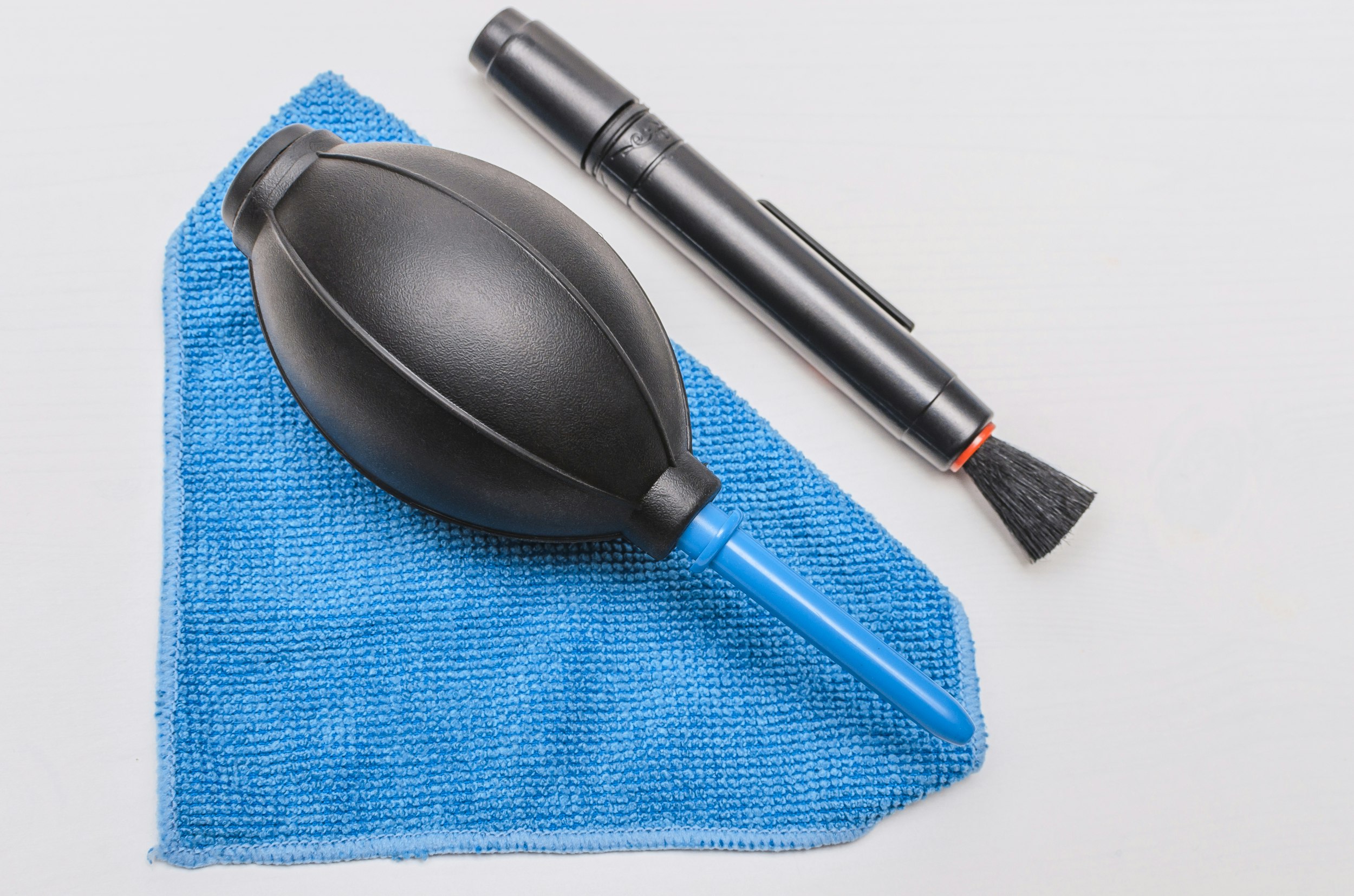A microfiber towel, a brush and an air blower. 