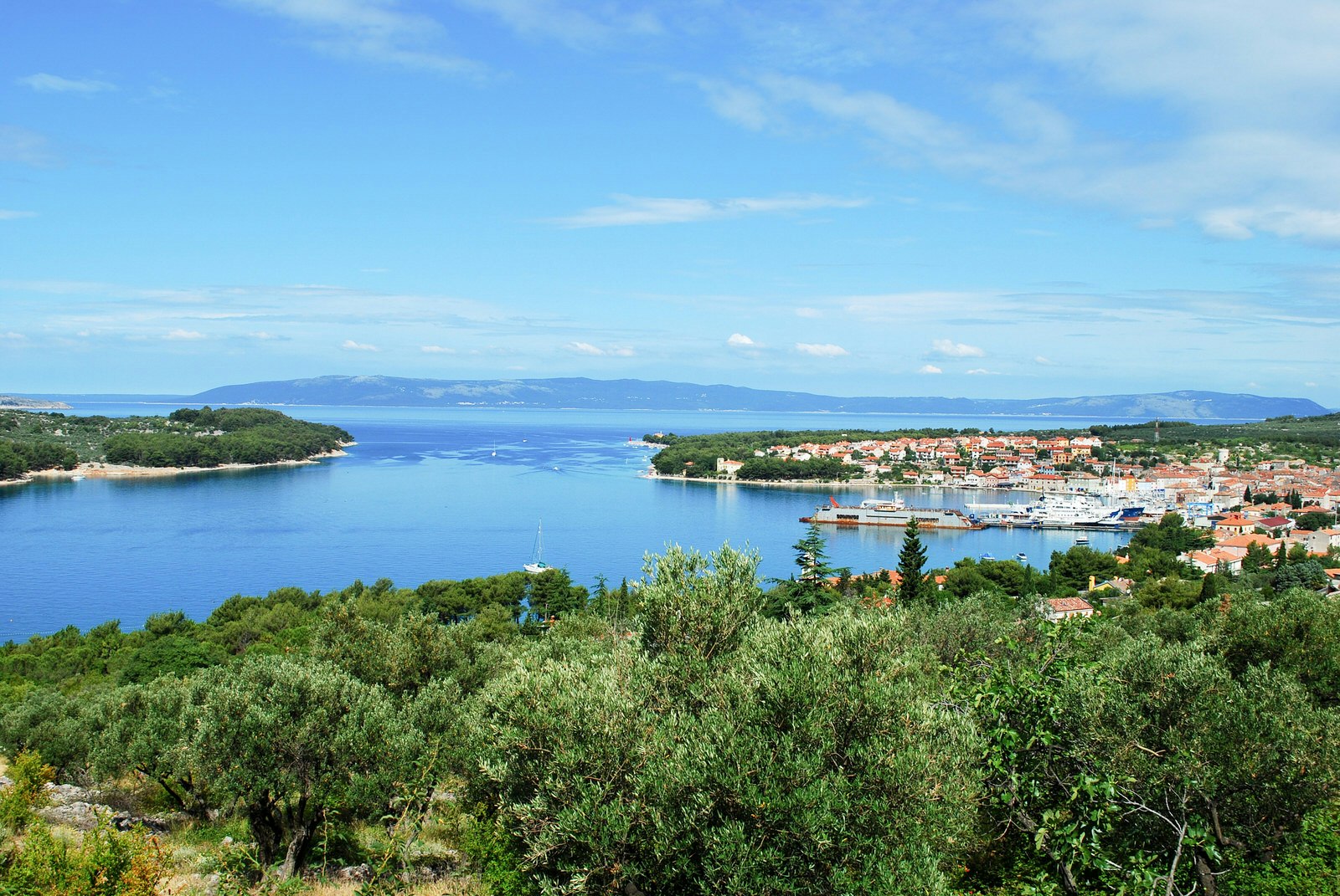 A panoramic shot of the small port on the island of Lošinj, Croatia on a sunny day