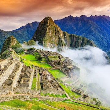 Machu Picchu shrouded in clouds.