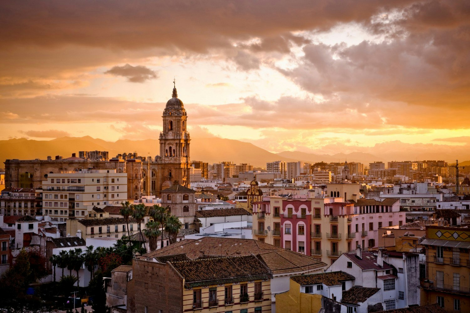 A view of Malaga at sunset