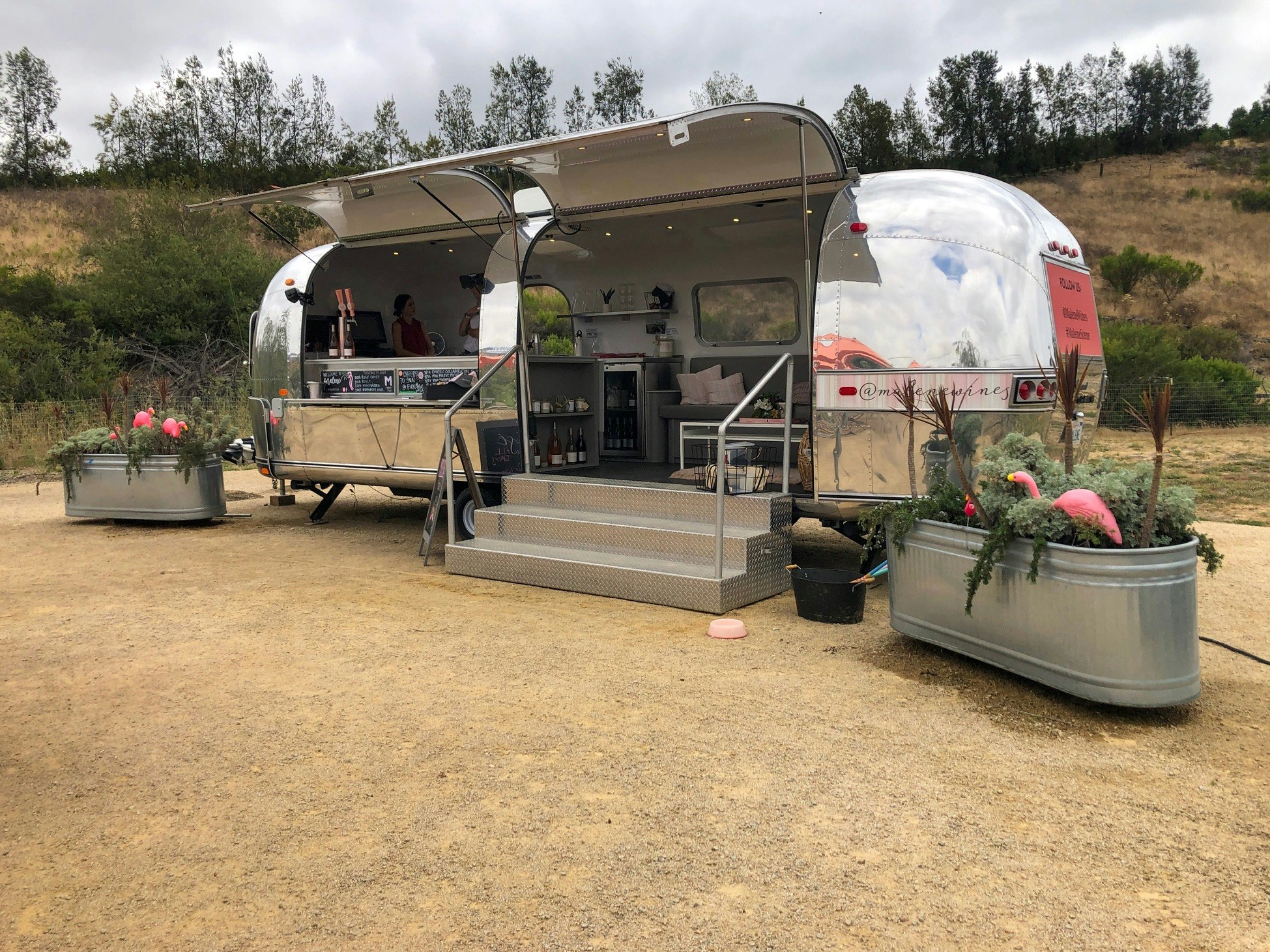 An airstream trailer that's been converted into an open tasting room.