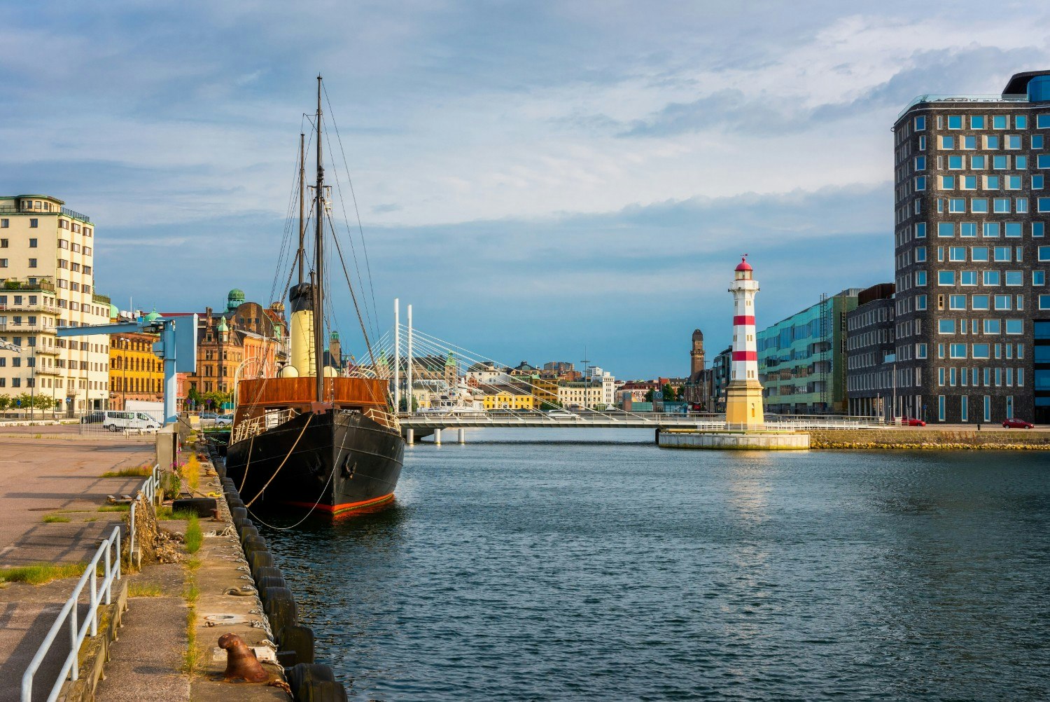 The Malmo Harbor with a lighthouse and bridge.