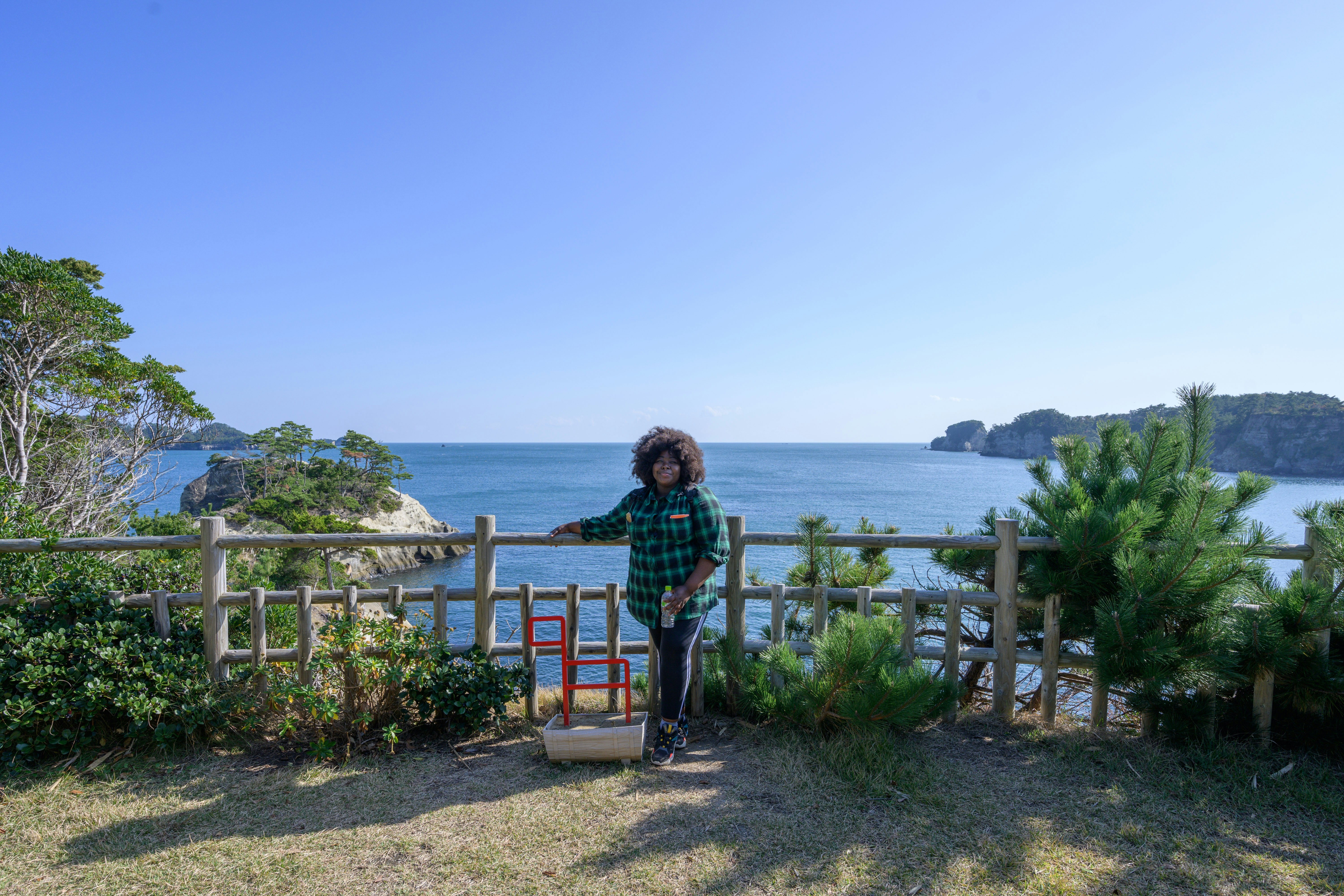 Stephanie Yeboah poses at the top of the trail with Masushima Bay behind her.