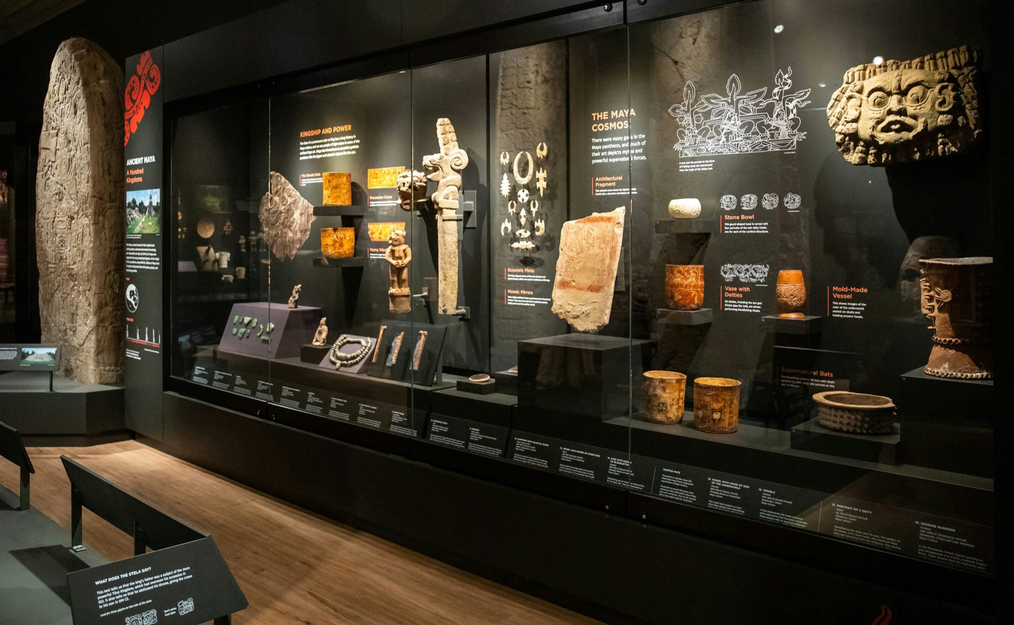 A glass exhibit case showcases artifacts from Mesoamerica at the Penn Museum in Philadelphia