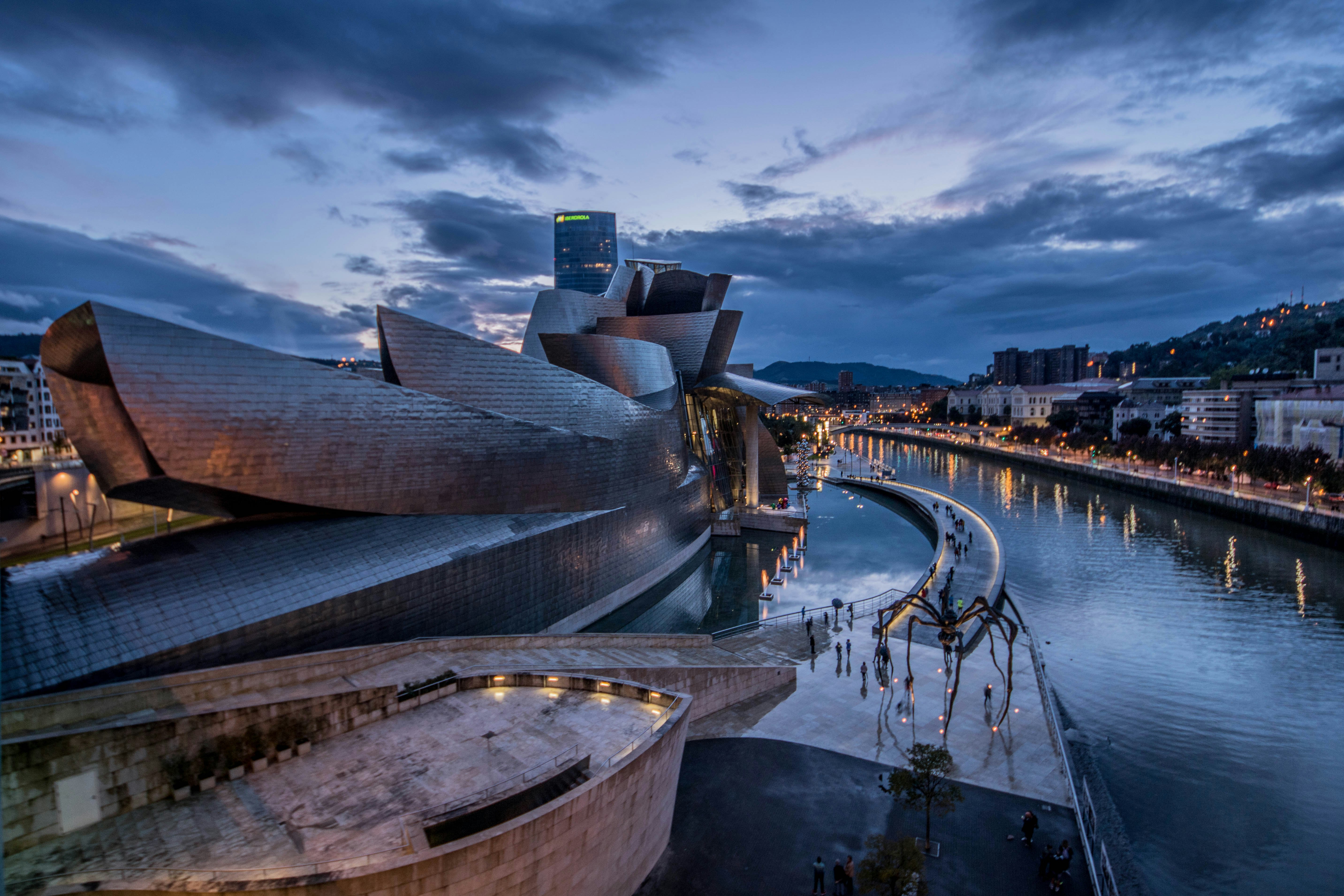 A view of Museo Guggenheim Bilbao from above, resembling a titanium ship.