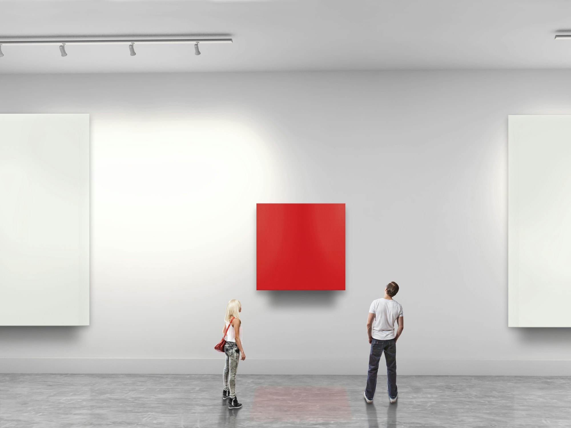 Couple looking at red blank art in gallery