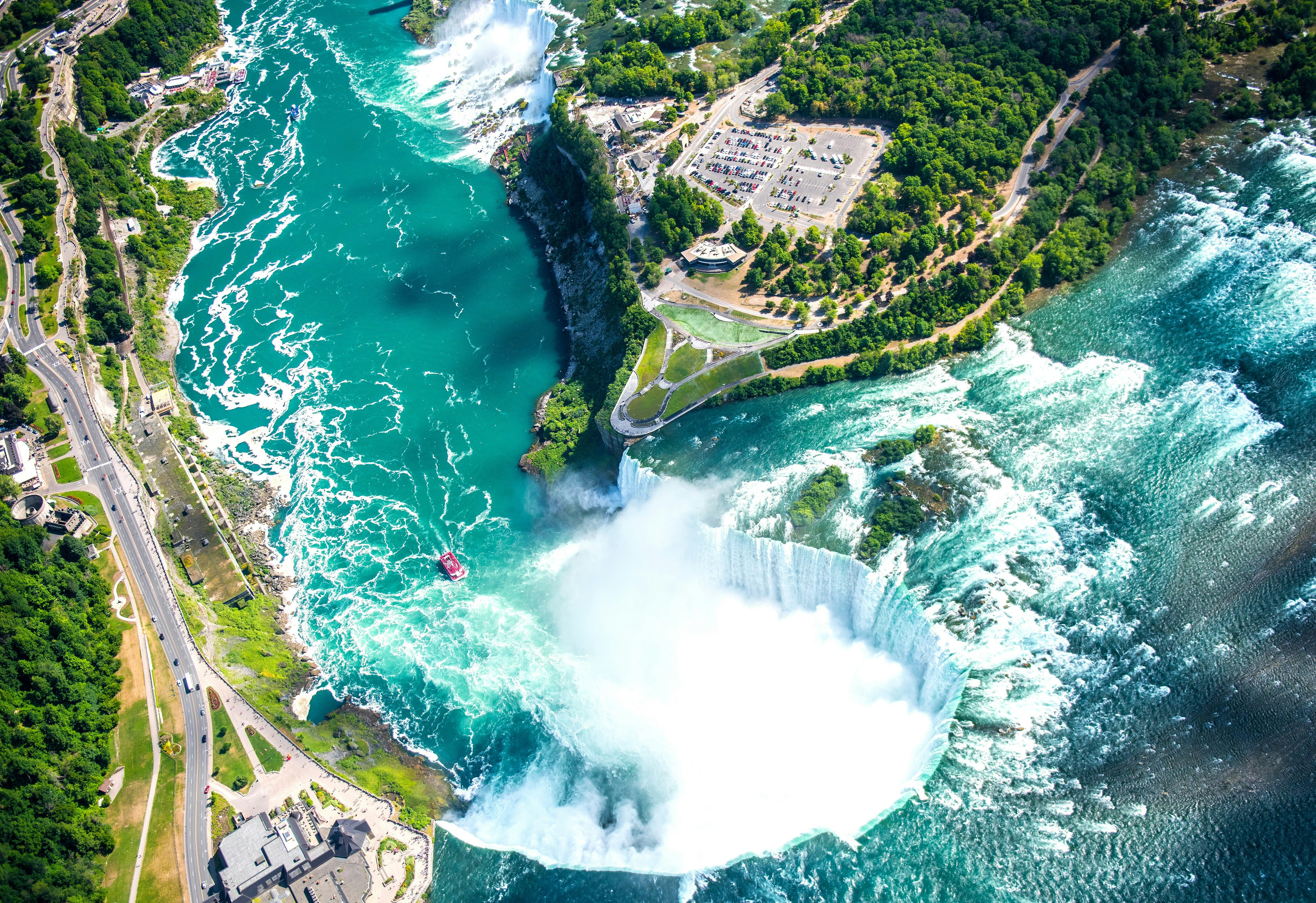 An aerial view of Niagara Falls, a group of three waterfalls at the southern end of Niagara Gorge.