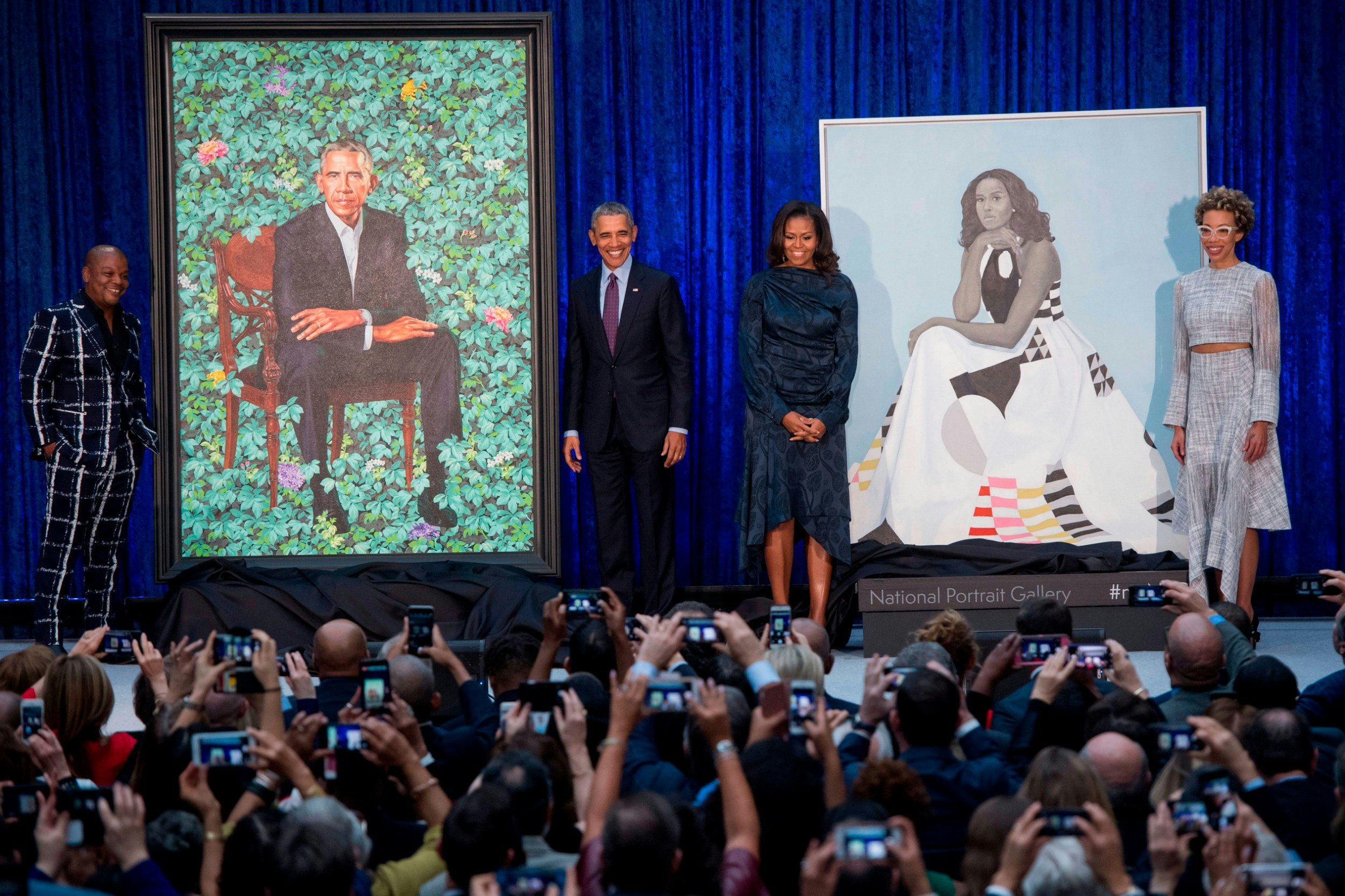 Barack and Michelle Obama at the unveiling of their portraits with the artists