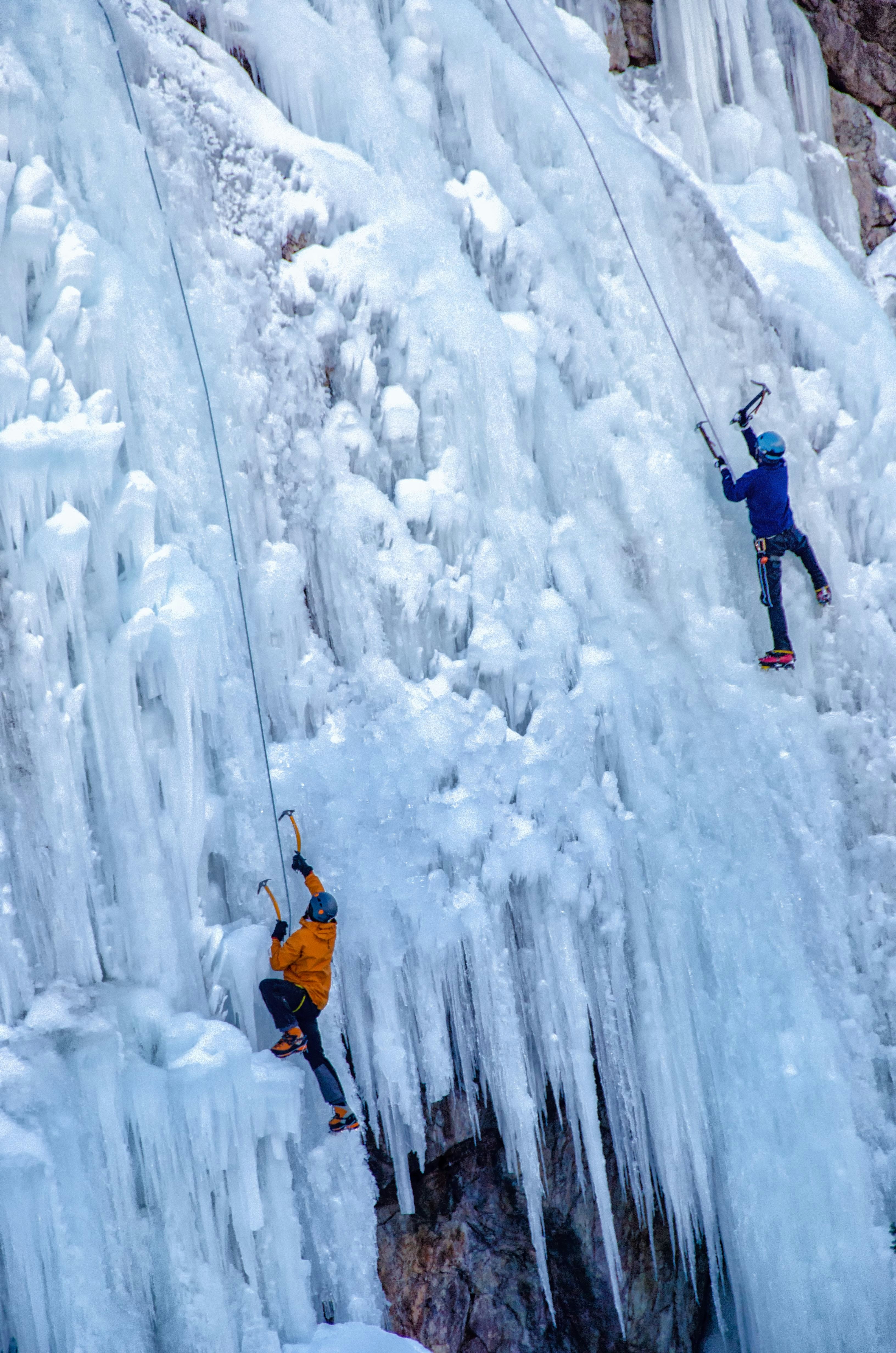 A pair of climbers scale a ice-covered mountain during the Ouray Ice Climbing Festival in Colorado