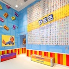 PEZ line the wall at the PEZ factory.jpg