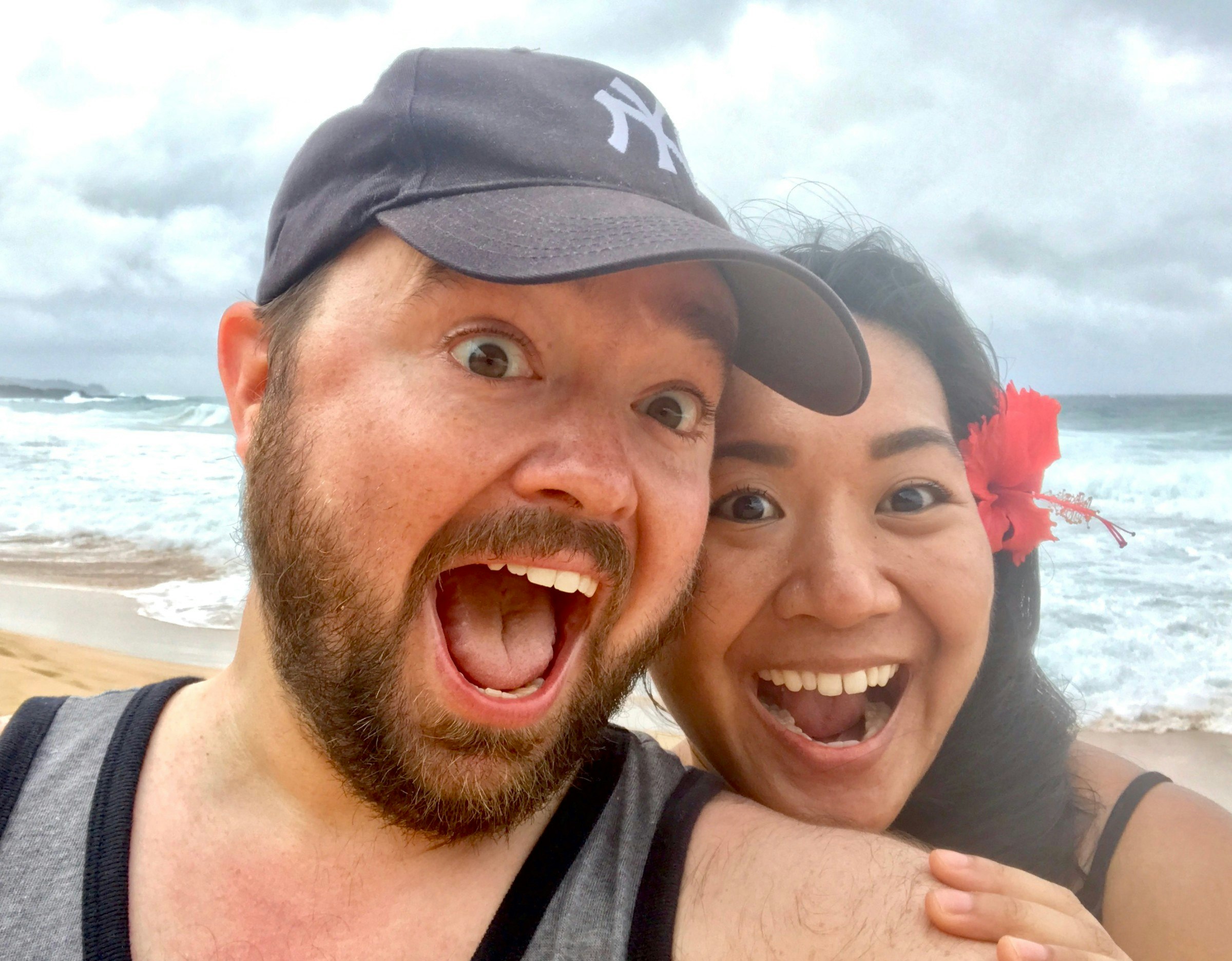 Paddy and Christine pose open-mouthed for a beach selfie.