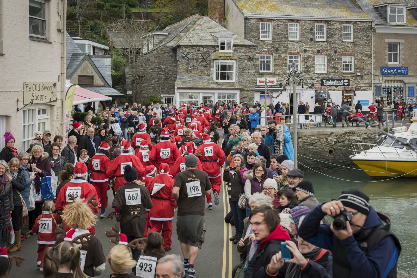Santa and reindeer race at the Padstow Christmas Festival, raising money for Cornwall Hospice Care.