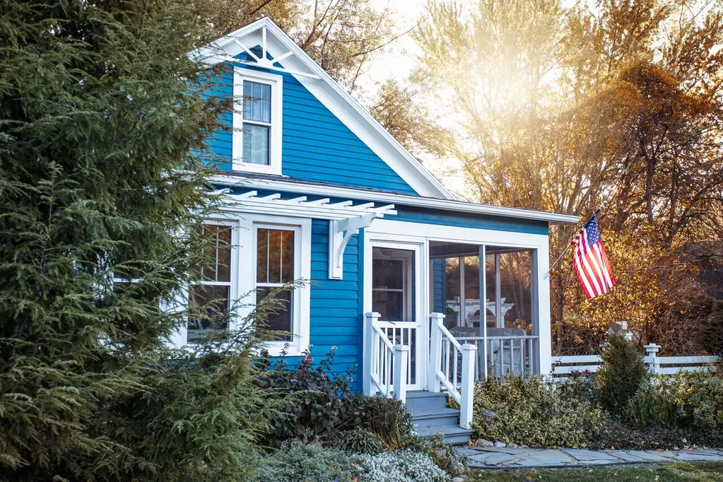 A blue cottage with white trim in Michigan