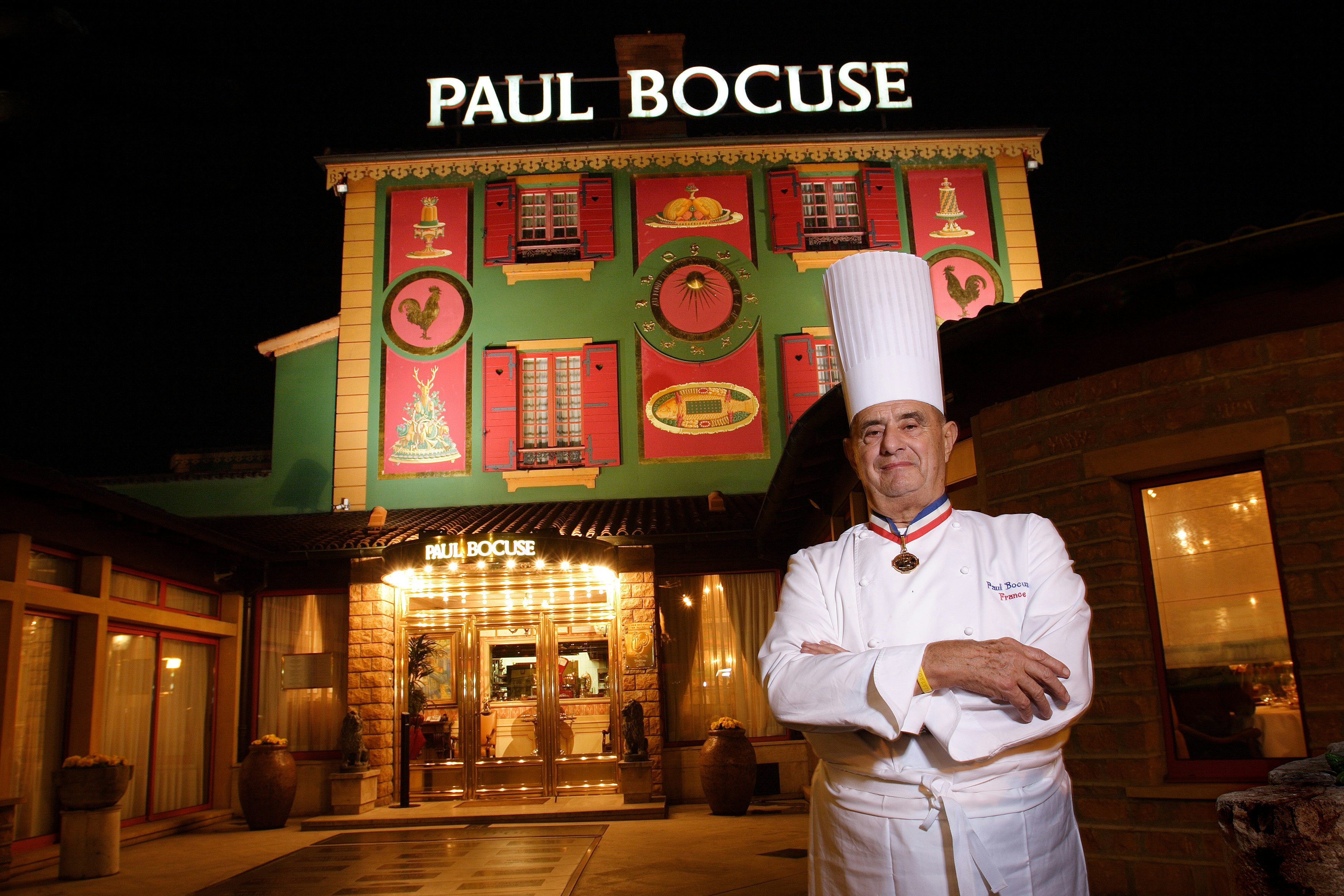 Chef Paul Bocuse outside his flagship restaurant, l'Auberge du Pont de Collonges.