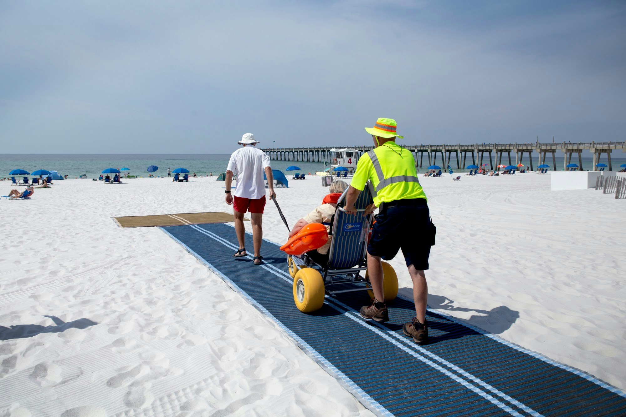 People testing the Mobi-Mat on a beach inn Pensacola Beach in Florida