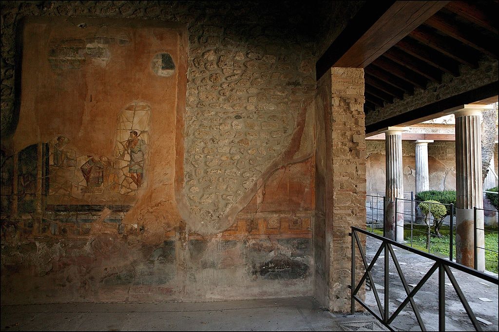Large room with large mythological murals in Pompeii's House of Golden Cupids