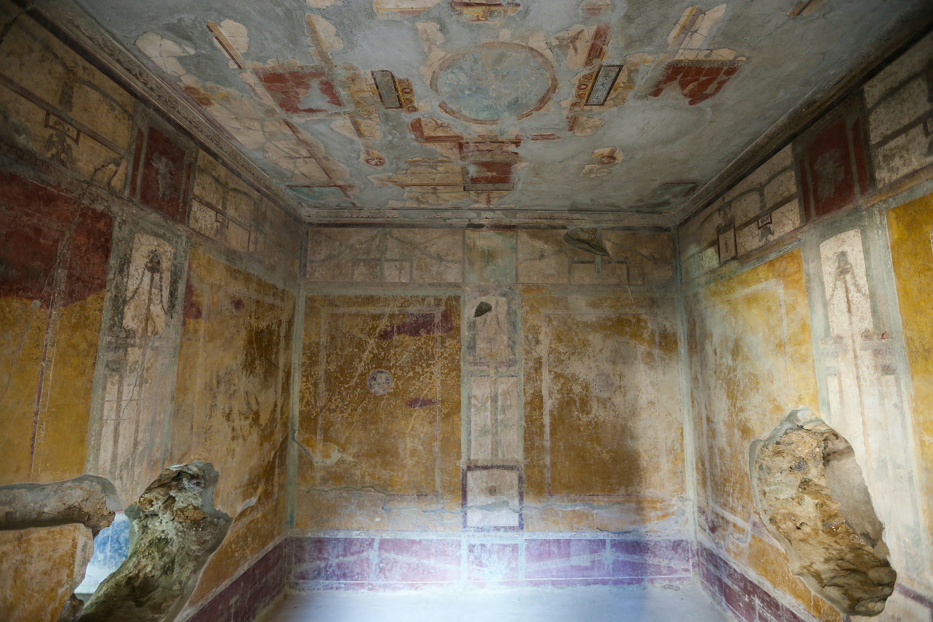 A view of a room, completely frescoed, in Pompeii's House of Lovers