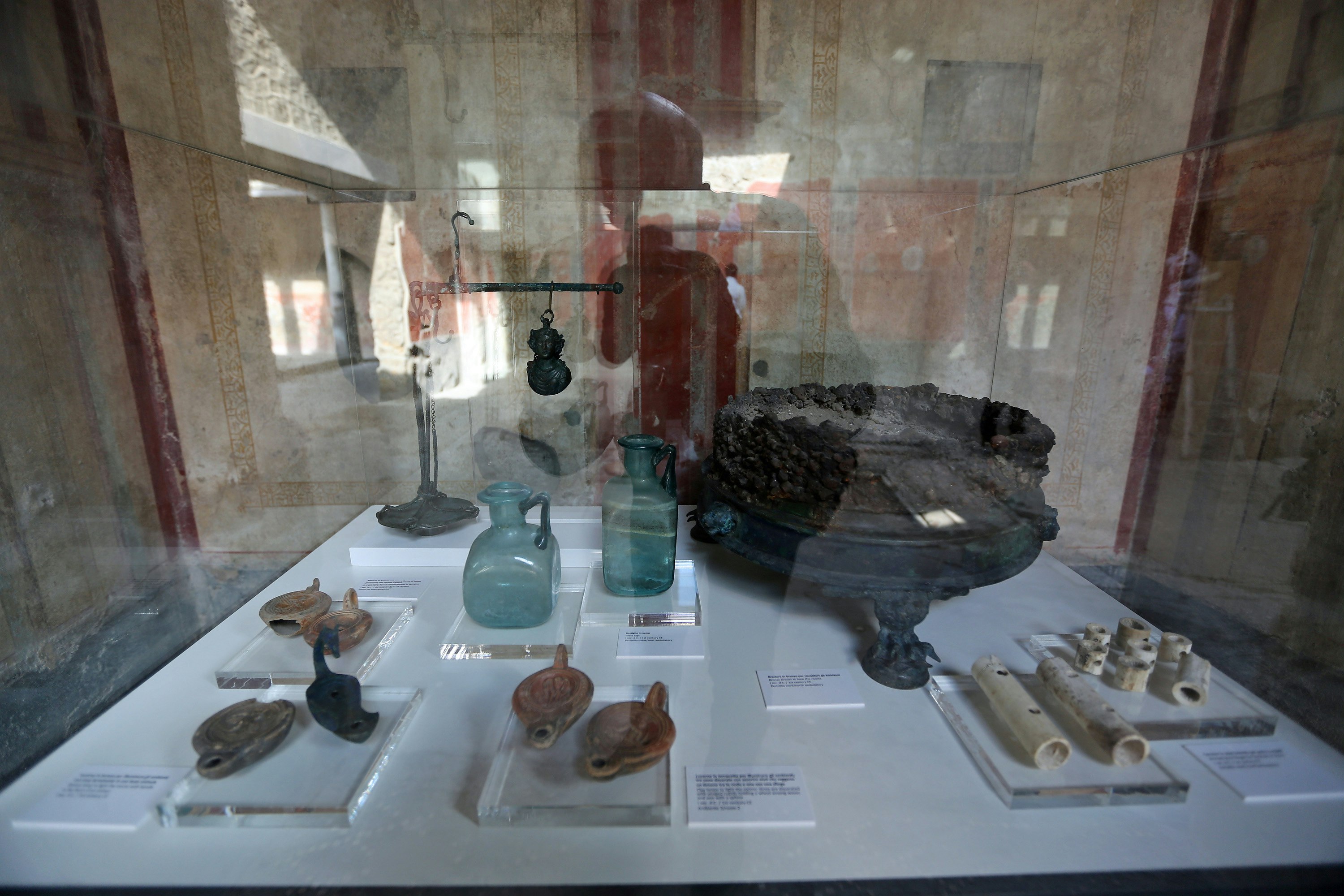 Glass jars and bottles on display from Pompeii's House of Lovers