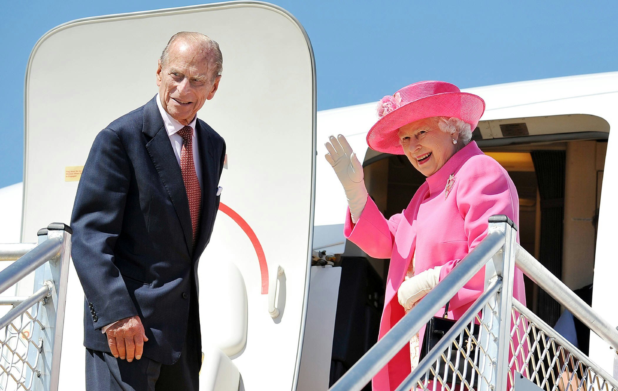 The Queen and Prince Philip boarding a plane