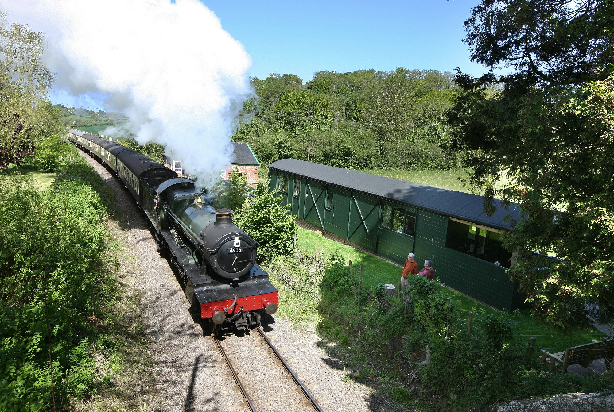 A vintage train passing The Railway Cottage in Somerset.jpg