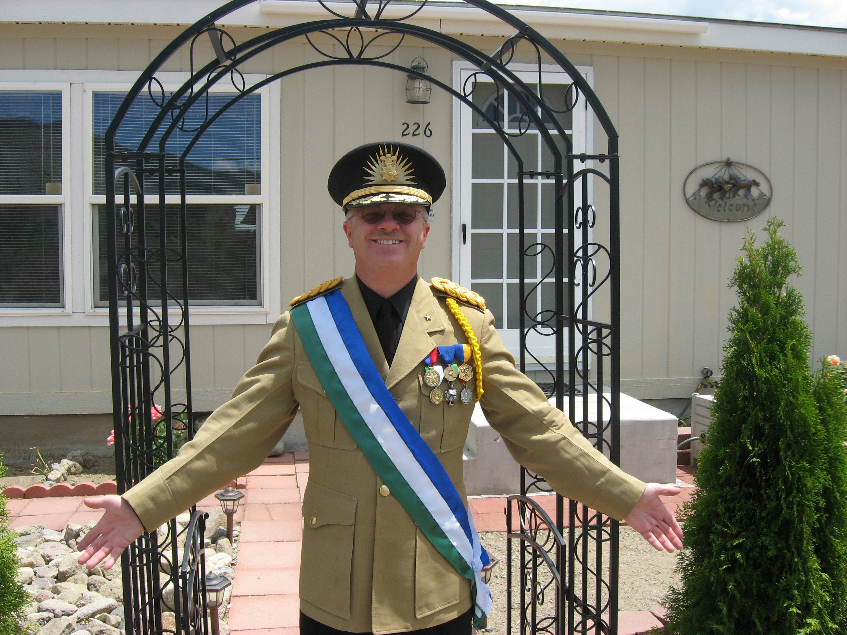 Kevin Baugh standing outside the home that is the Republic of Molossia