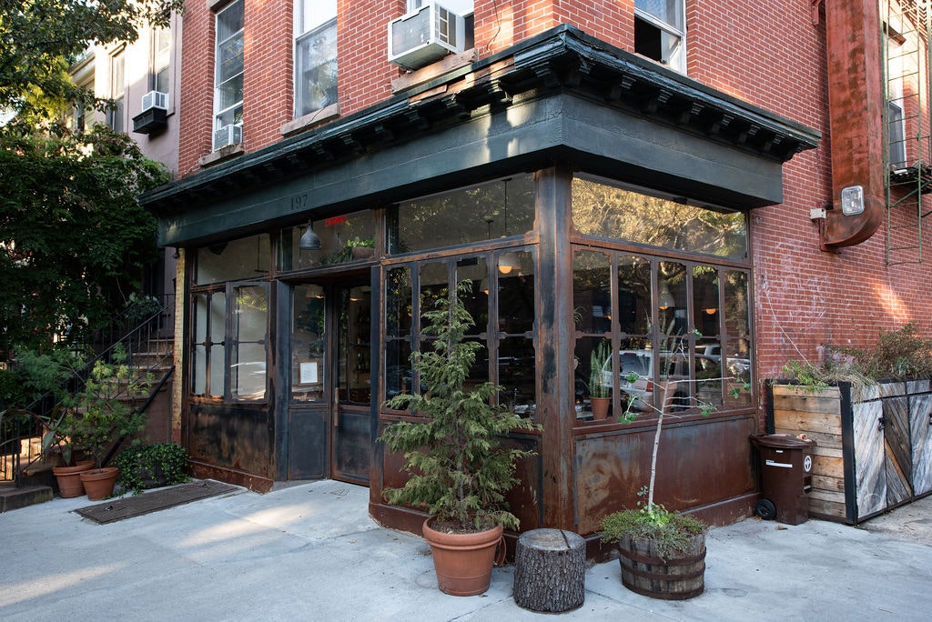 A brick and steel corner building with big windows on a corner in Fort Greene, Brooklyn 