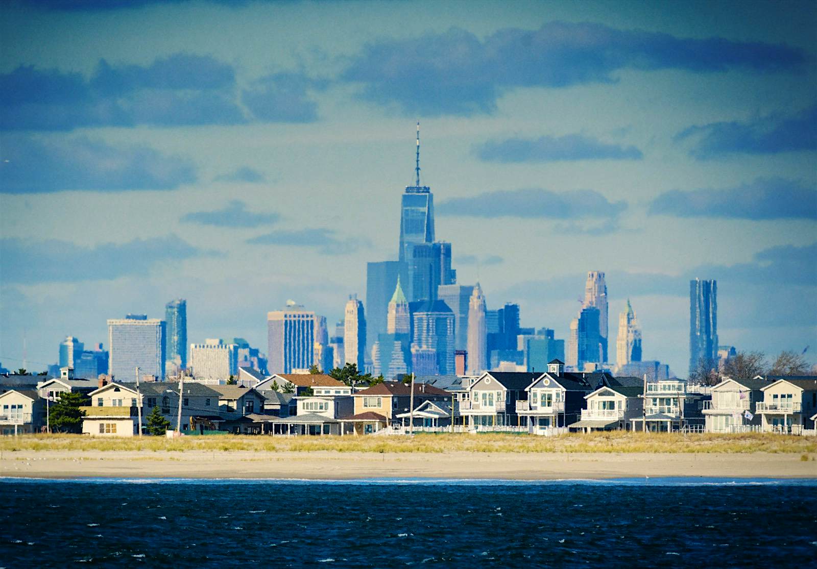 Rockaways New York.jpg A line of beach houses with New York City in the background