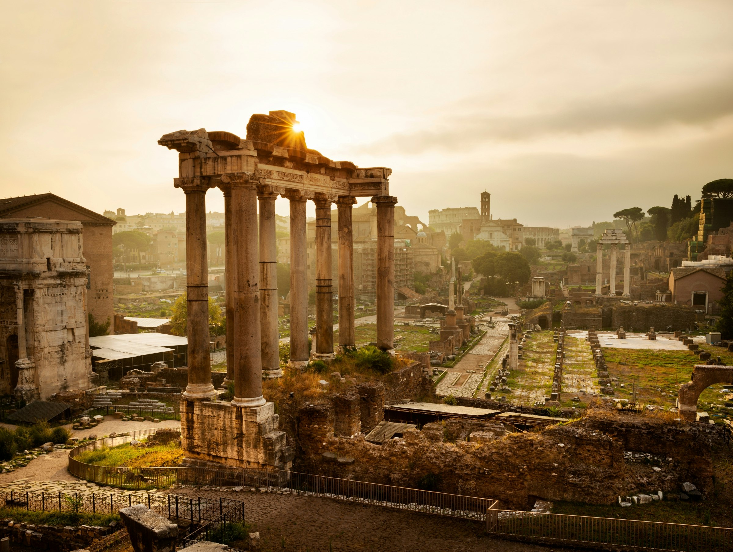 The Roman Forum, backlit by sun, in Rome, Italy 