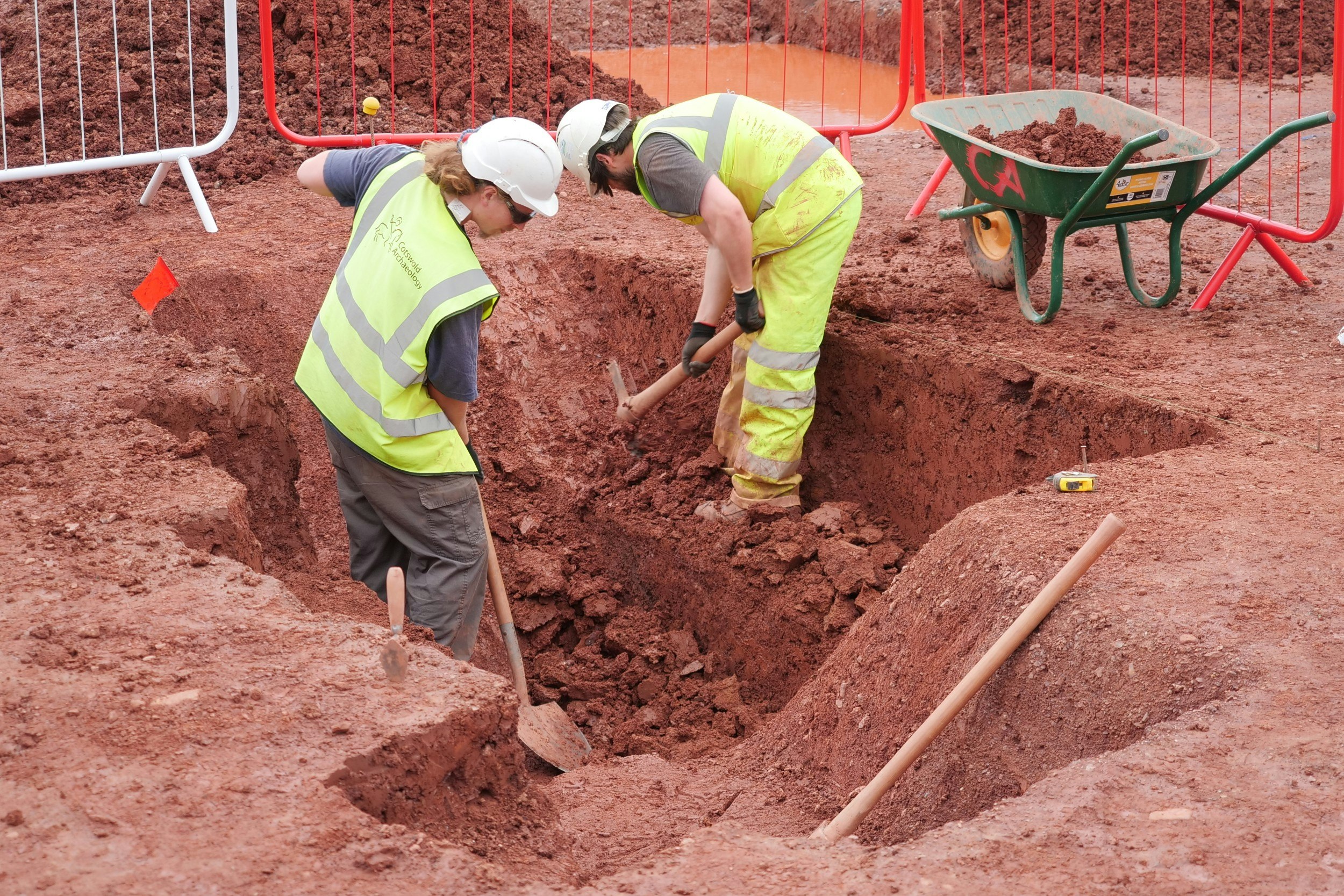 Two archaeologists working on the redevelopment of an English bus station in Exeter 