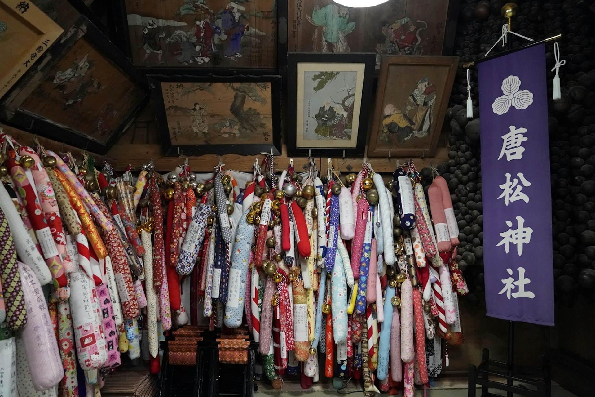 Colourful ropes and bells gathered inside the shrine