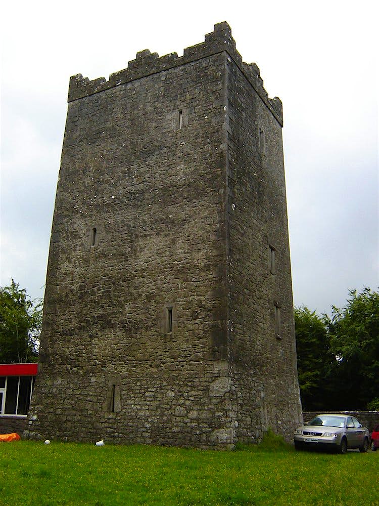 Ross-Castle.jpg Exterior view of Ross Castle on a cloudy day in Ireland. There's a car to the right of the structure; haunted places world