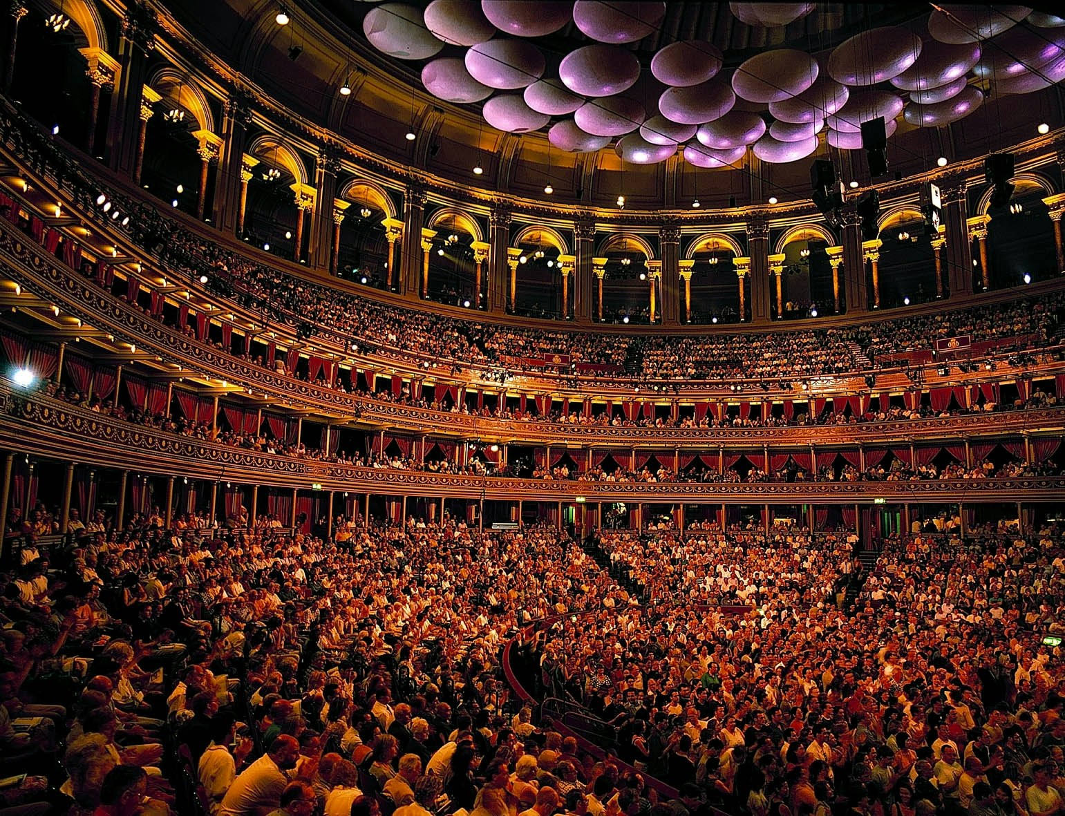 Full house at the Royal Albert Hall, a grand tiered circular venue in London.