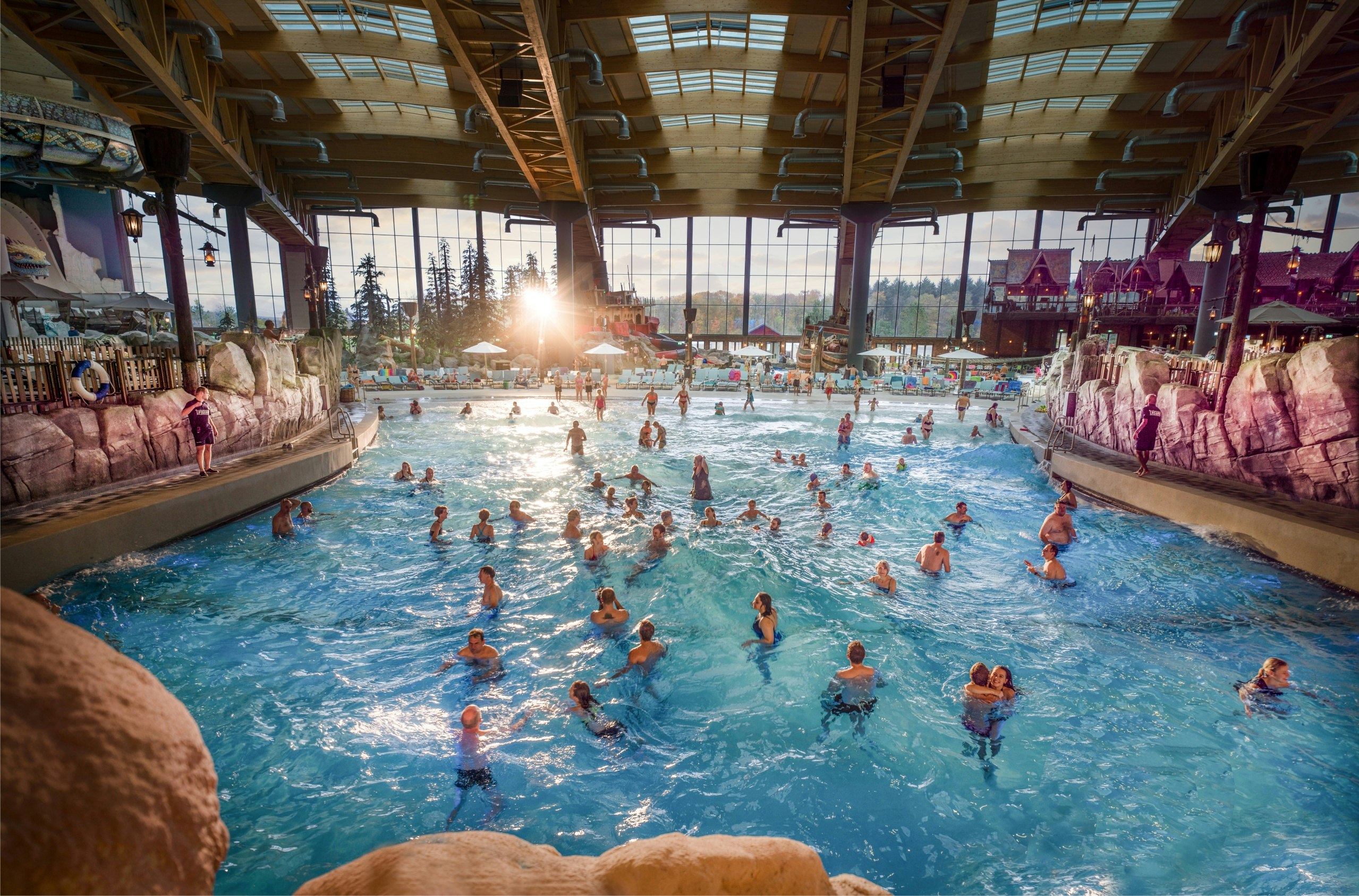 Aerial shot of people splashing about in an indoor water park