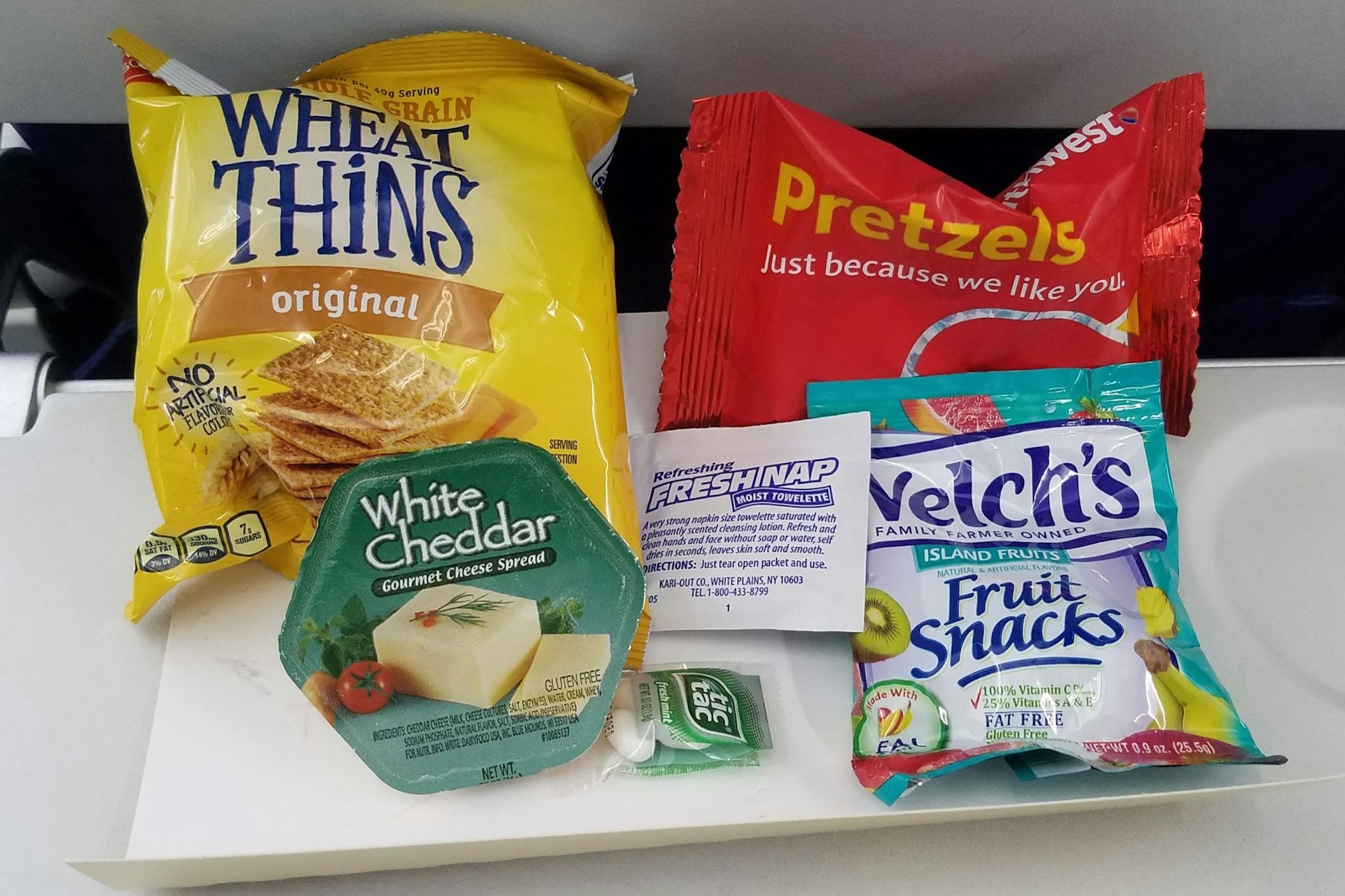 Crackers, cheese spread, pretzels and fruit chews are all that is served for Southwest flight to Hawaii lasting five hours or more.