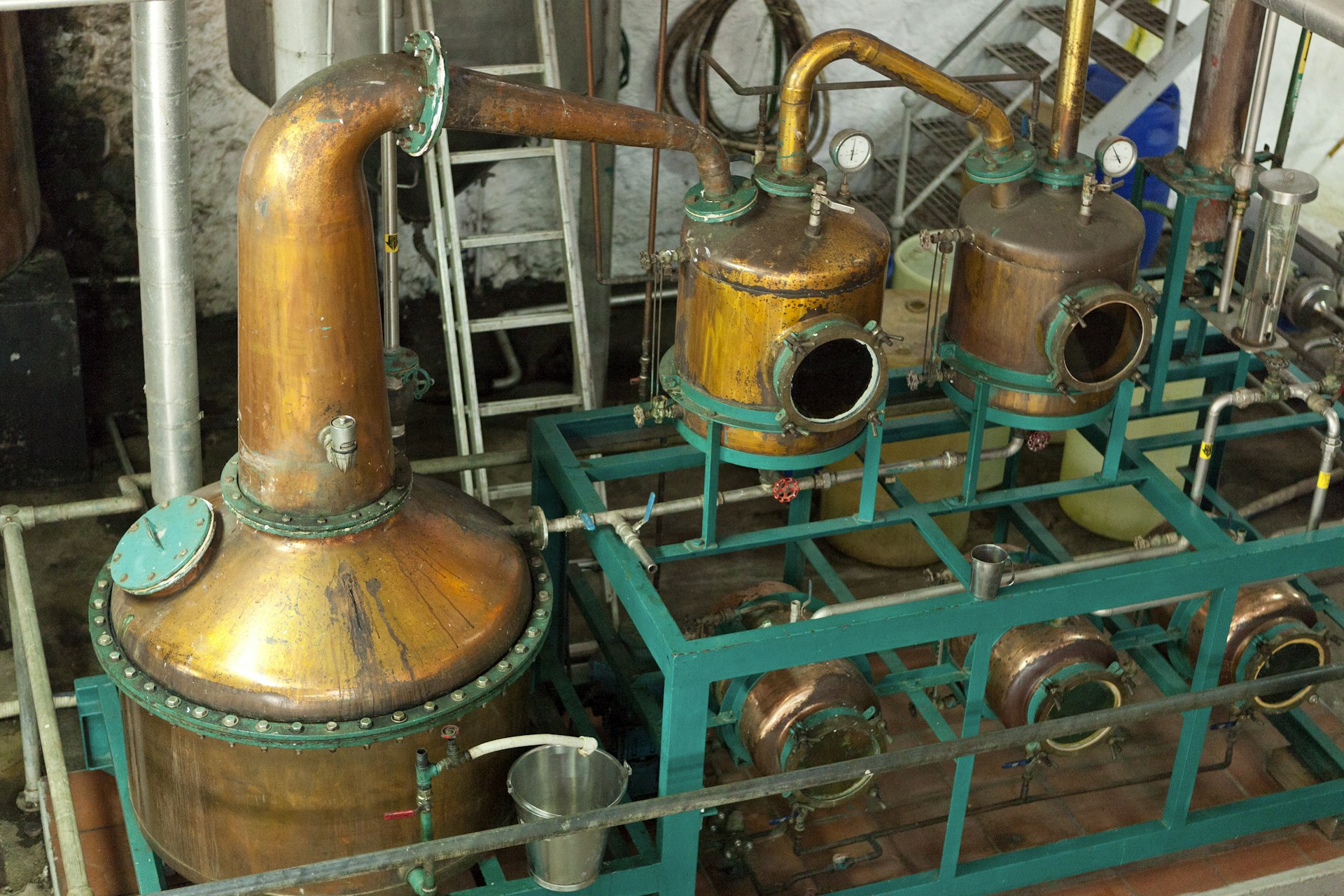 Aerial view of a trio of old rum distillery equipment made of tin in Saint Lucia 