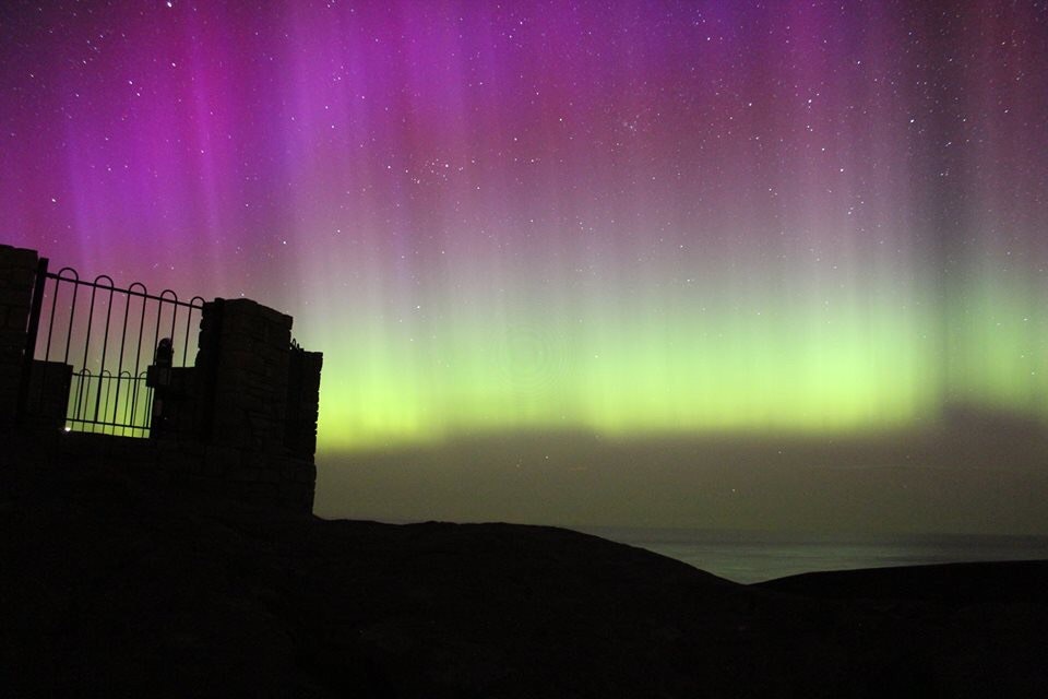 The northern lights behind Iceland's Sandrock Holiday Hostel