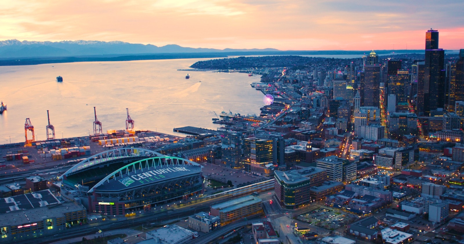 Aerial view of the city of Seattle at twilight; you can see many of the major attractions; nfl cities travel 
