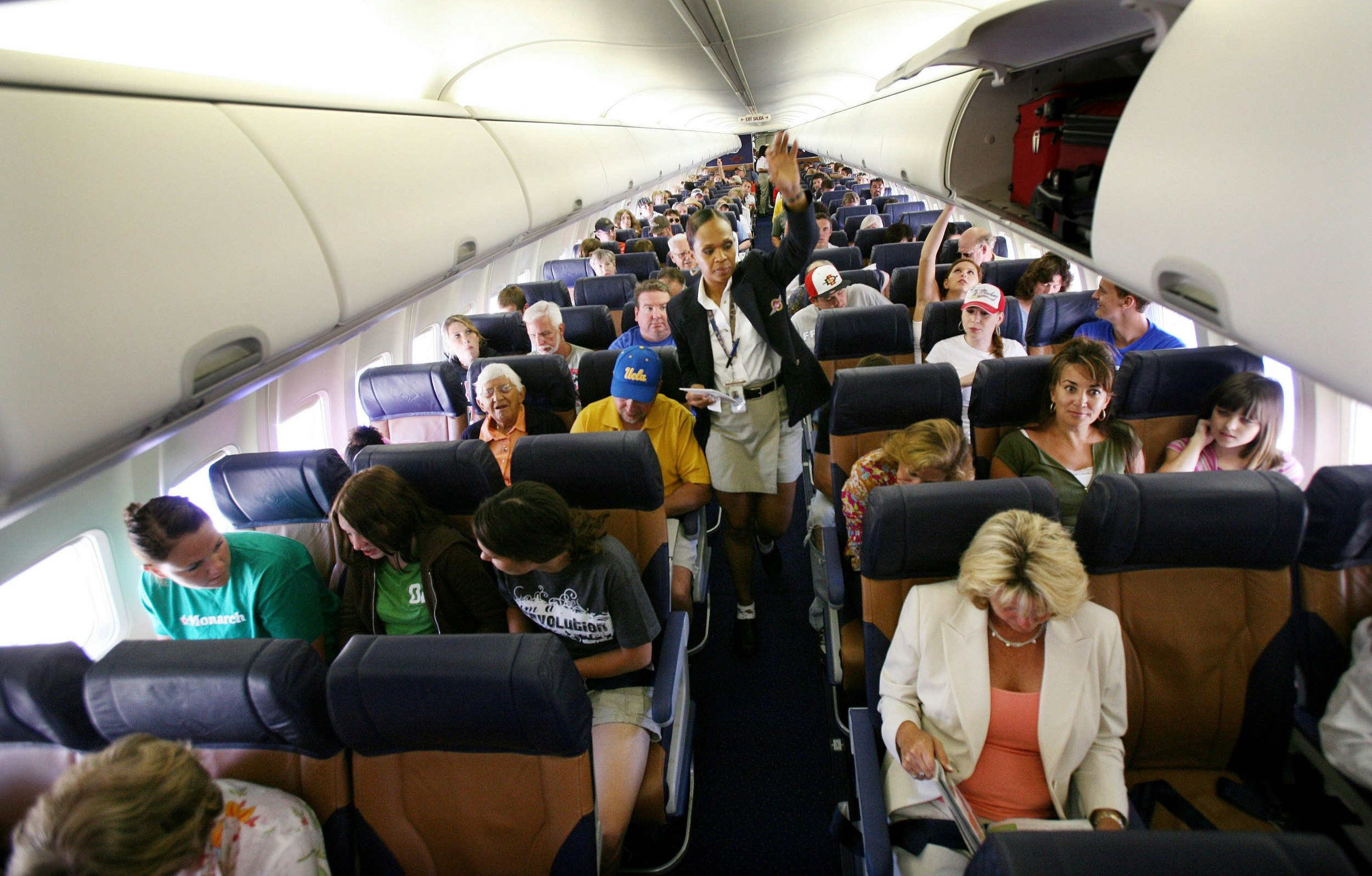 Passengers sit in their assigned seats before take-off at San Diego's Lindburgh Field Airport in San Diego, California