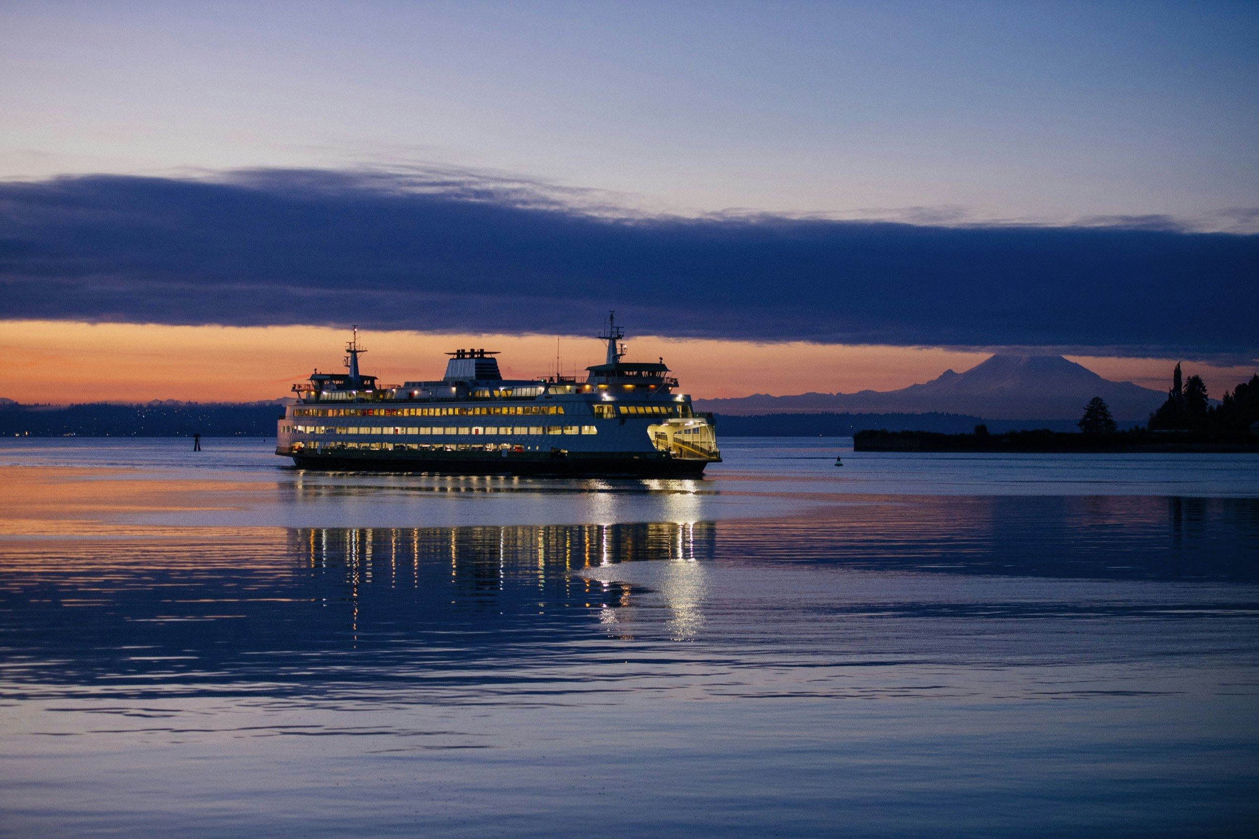 A ferry slips through Puget Sound off the coast of Seattle; Seattle Waterfront Activities